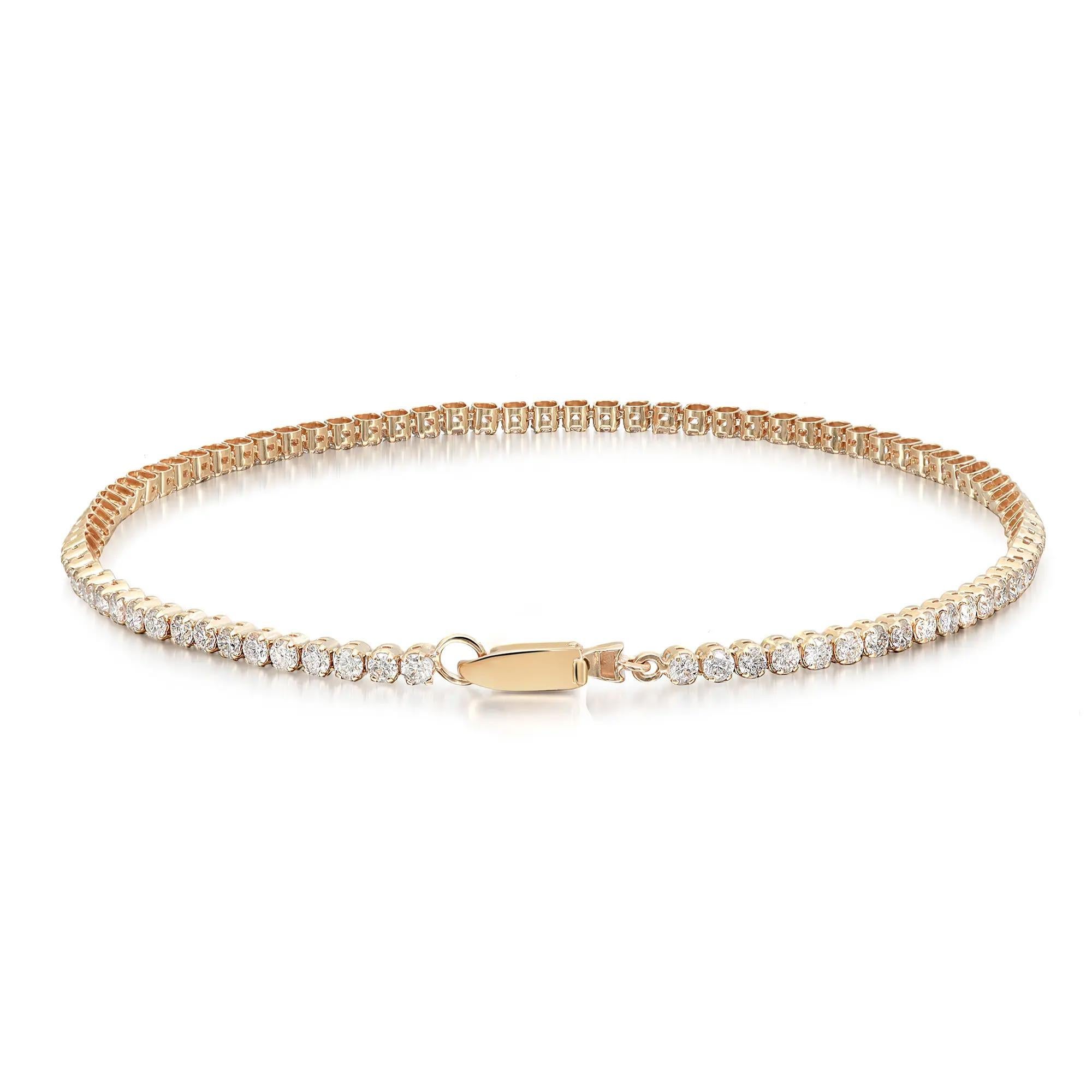 Add a touch of sparkle to your wrist with this beautiful and shimmering prong set round brilliant cut diamond tennis bracelet. Crafted in 14K yellow gold. Super stackable and easy to wear. Total diamond weight: 1.98 carats. Diamond color G-H and