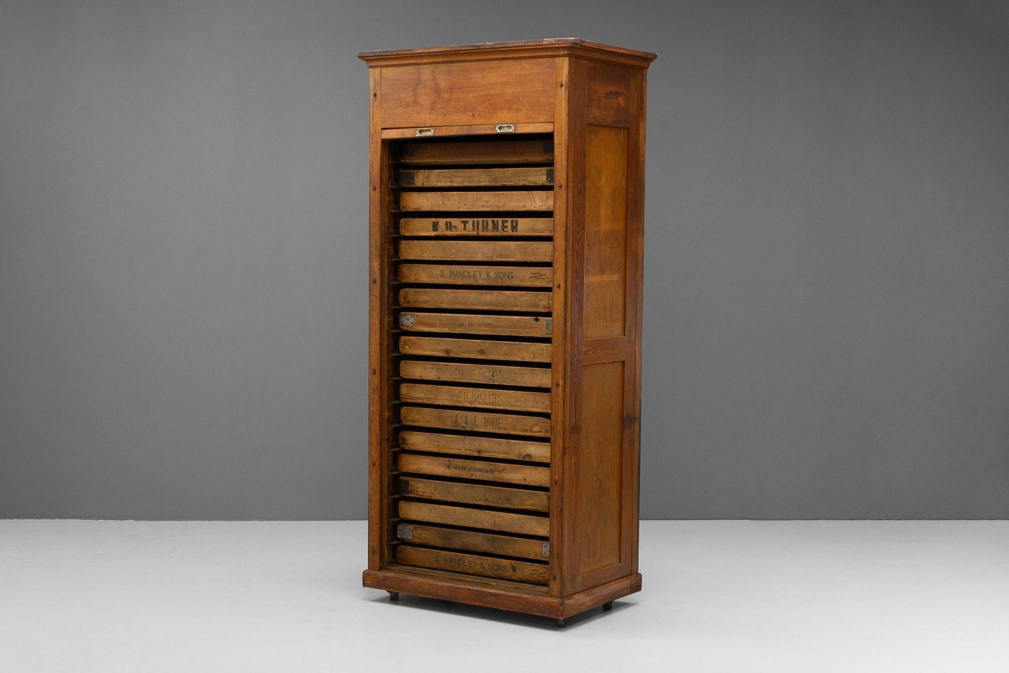 Tall 18 drawer pine pine bread proofing cupboard with shutter front and panelled sides. Circa 1900
H 218cm x W 99cm x D 64cm (Drawers H 7cm x W 76cm x D 45cm)