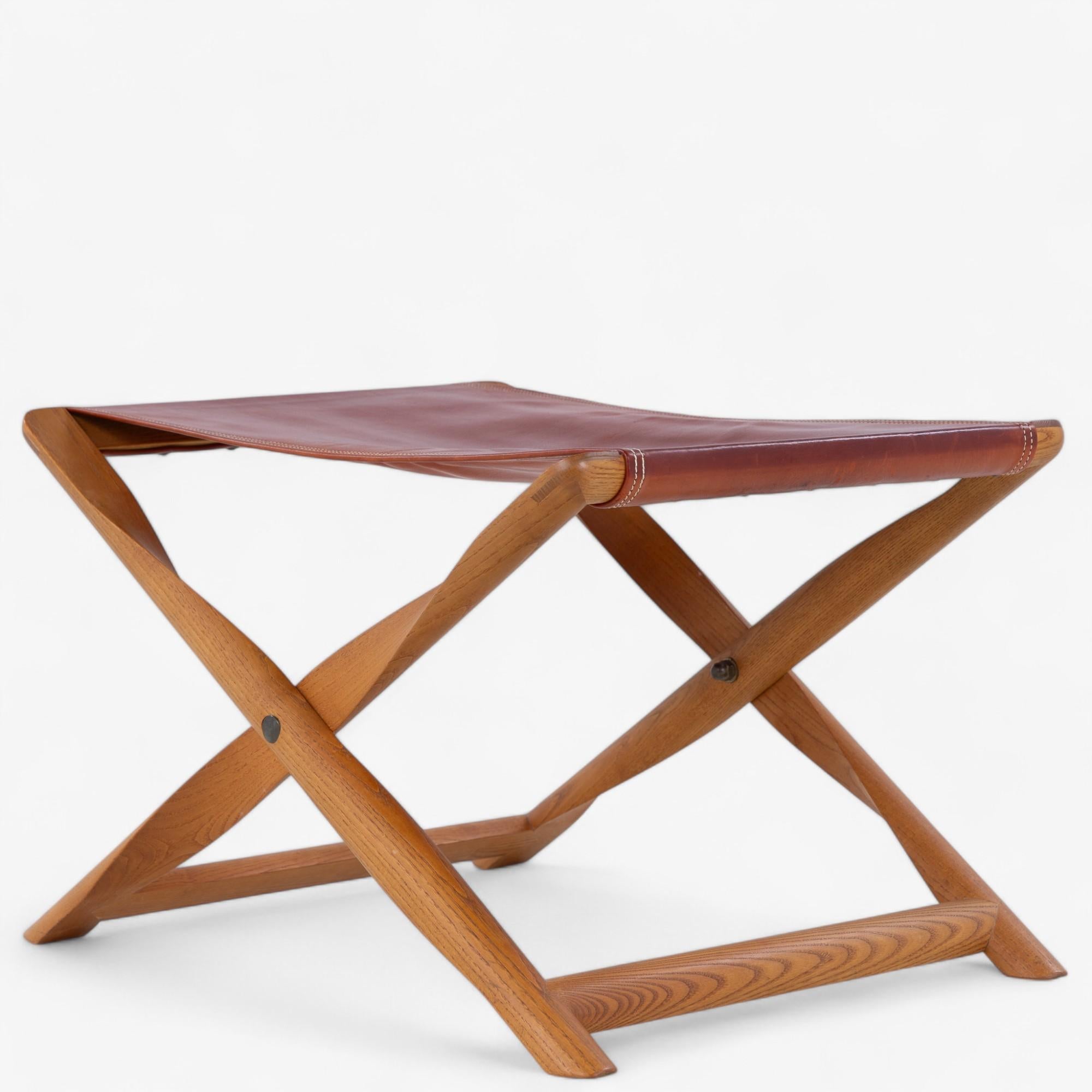 Propeller stool in patinated ash with red leather seating and a removable tray top. Designed by Kaare Klint and made by cabinetmaker Rud Rasmussen.