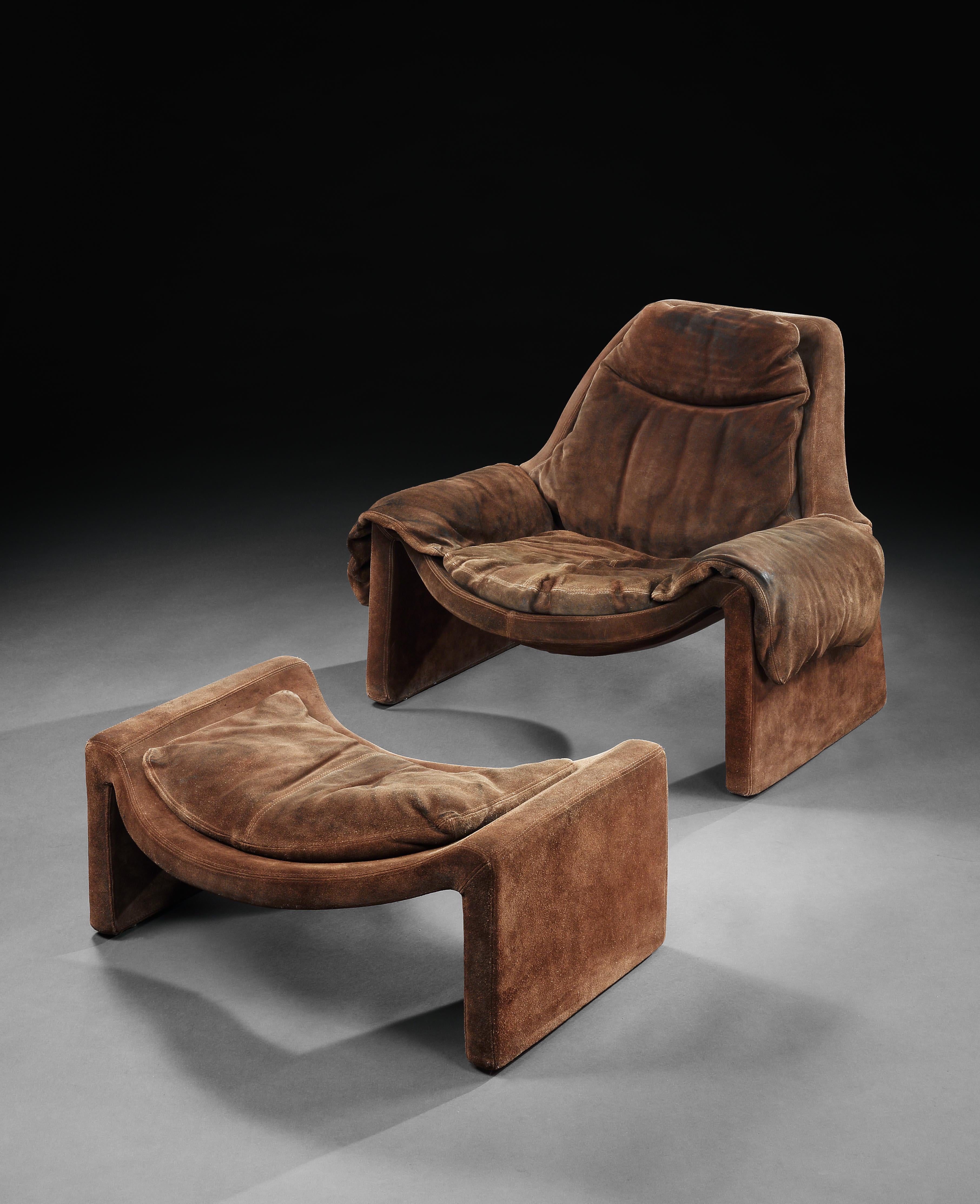 A really comfortable armchair with a striking, saddle-effect seat and matching ottoman echoing and complementing the curves of the armchair. Both retaining their original brown suede upholstery. Harmonic steel frames, injected polyurethane foam and