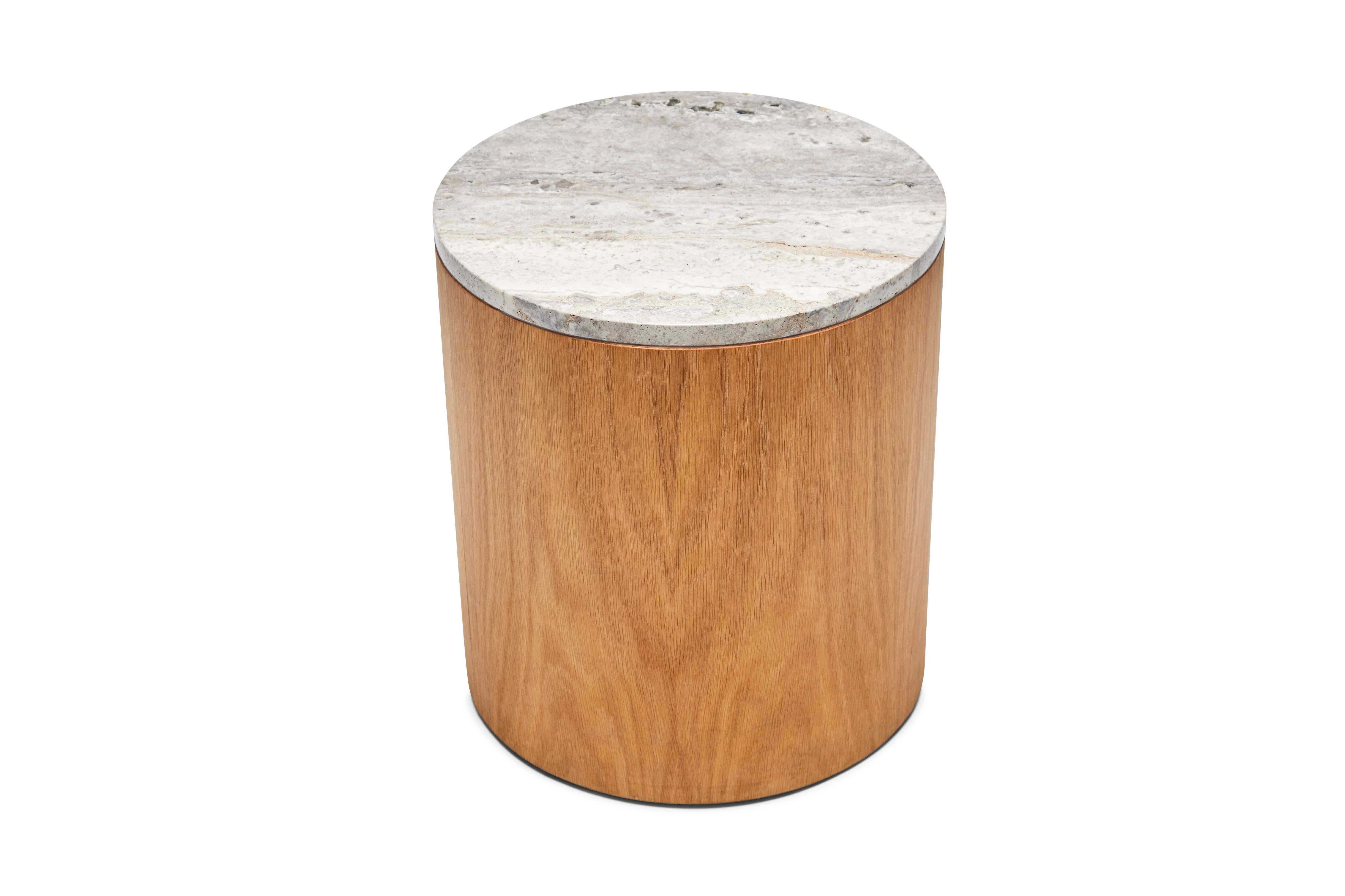 The Prospect table is a drum table which features either an American walnut or white oak exterior and a stone top. Shown here in titanium travertine and oiled oak.

The Lawson-Fenning Collection is designed and handmade in Los Angeles,