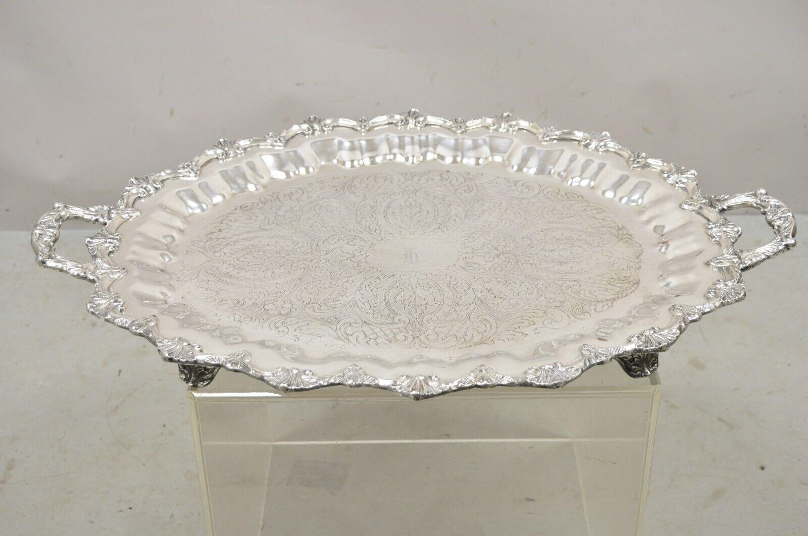 Prospect Silver Co Silver Plated Victorian Style Twin Handle Serving Platter. Item raised on ornate feet, fancy twin handles, floral etched center, original hallmark, very nice vintage item, great style and form. circa early to mid 20th century.