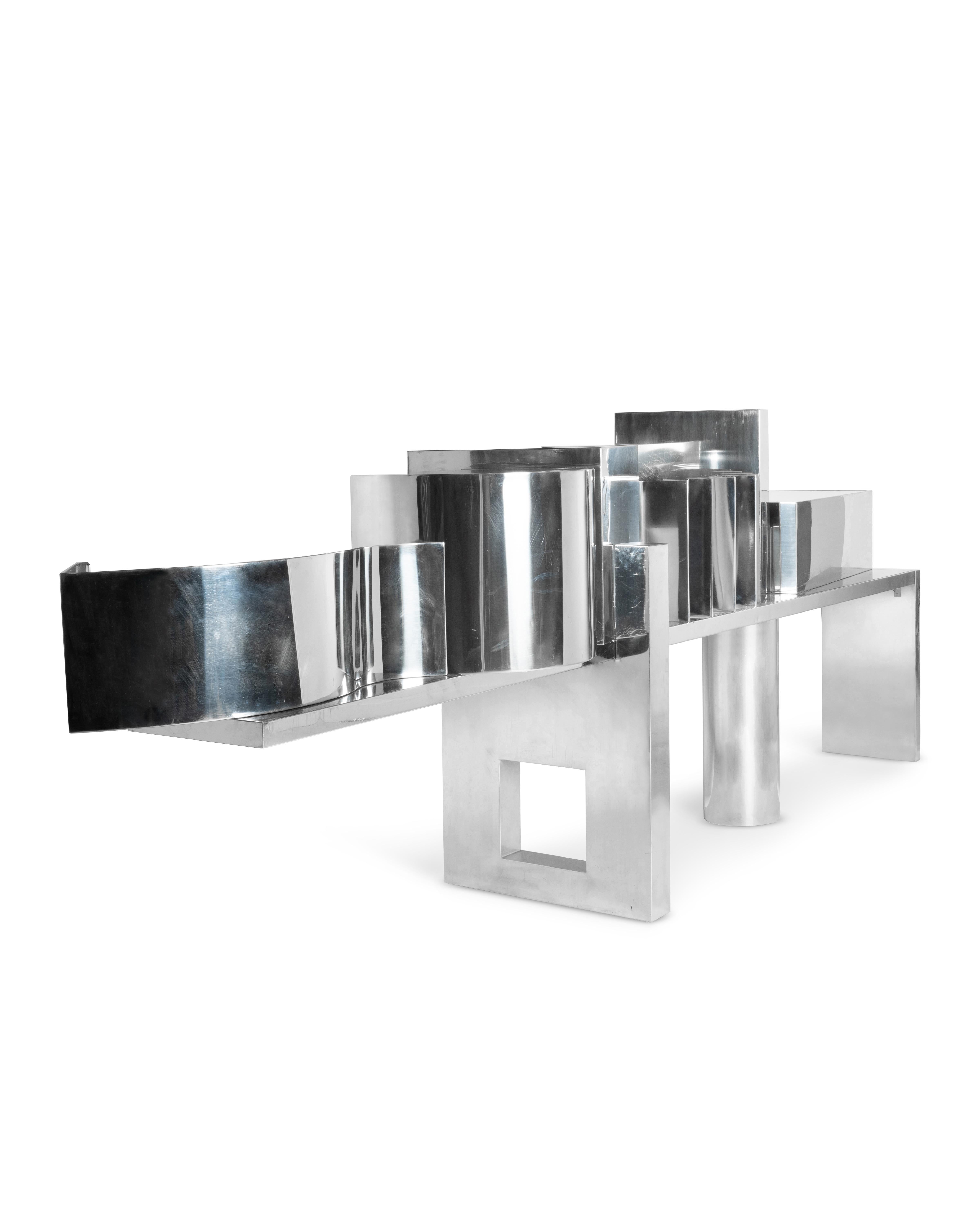 PROSPERO RASULO (Born in 1953) Spectacular architectural piece of furniture forming a stainless steel bar, geometric base composed of a side panel, a central cylinder and a large cut-out square, extending at the rear for an old overhanging upright,