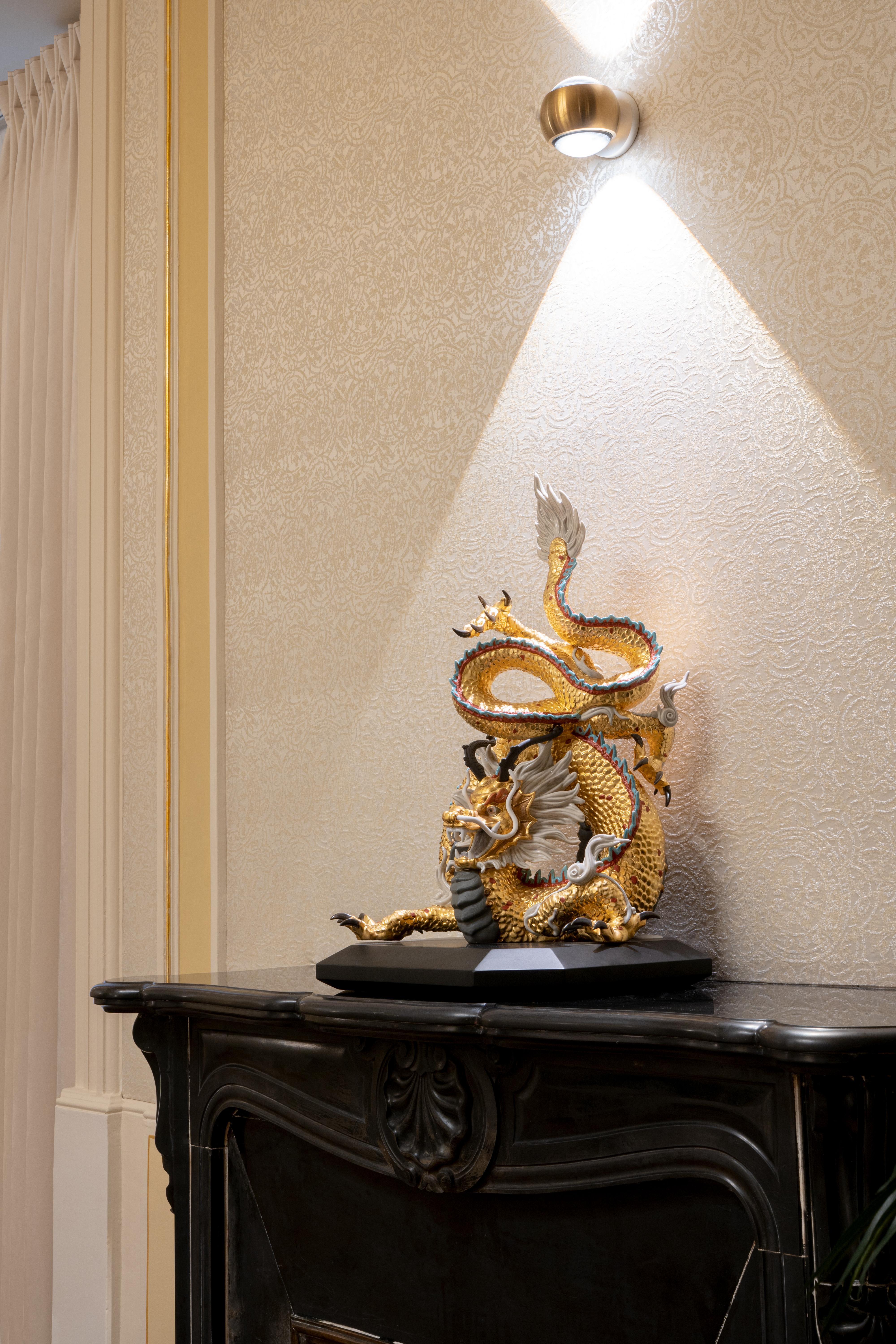 Limited edition High Porcelain sculpture of a dragon, the symbol of power and good fortune in Asian cultures, in a special version to commemorate Lladró’s 70th anniversary. A representation of its supreme power over all creatures in oriental