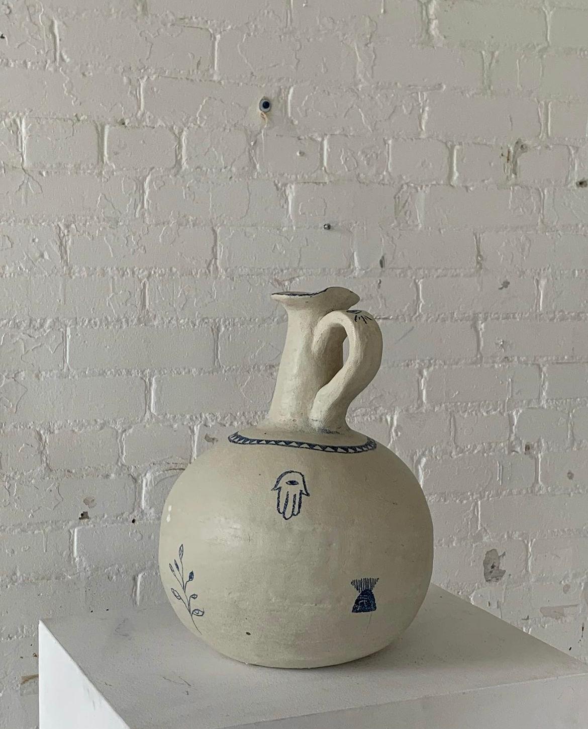 Protector vase 1 by Solem Ceramics
Dimensions: Ø 25.5 x H 35.5 cm.
Materials: White stoneware, blue underglaze, glaze
This vase is water safe. 

Solem’s work pulls from memories of the architecture and community within SWANA and Southeast Asia