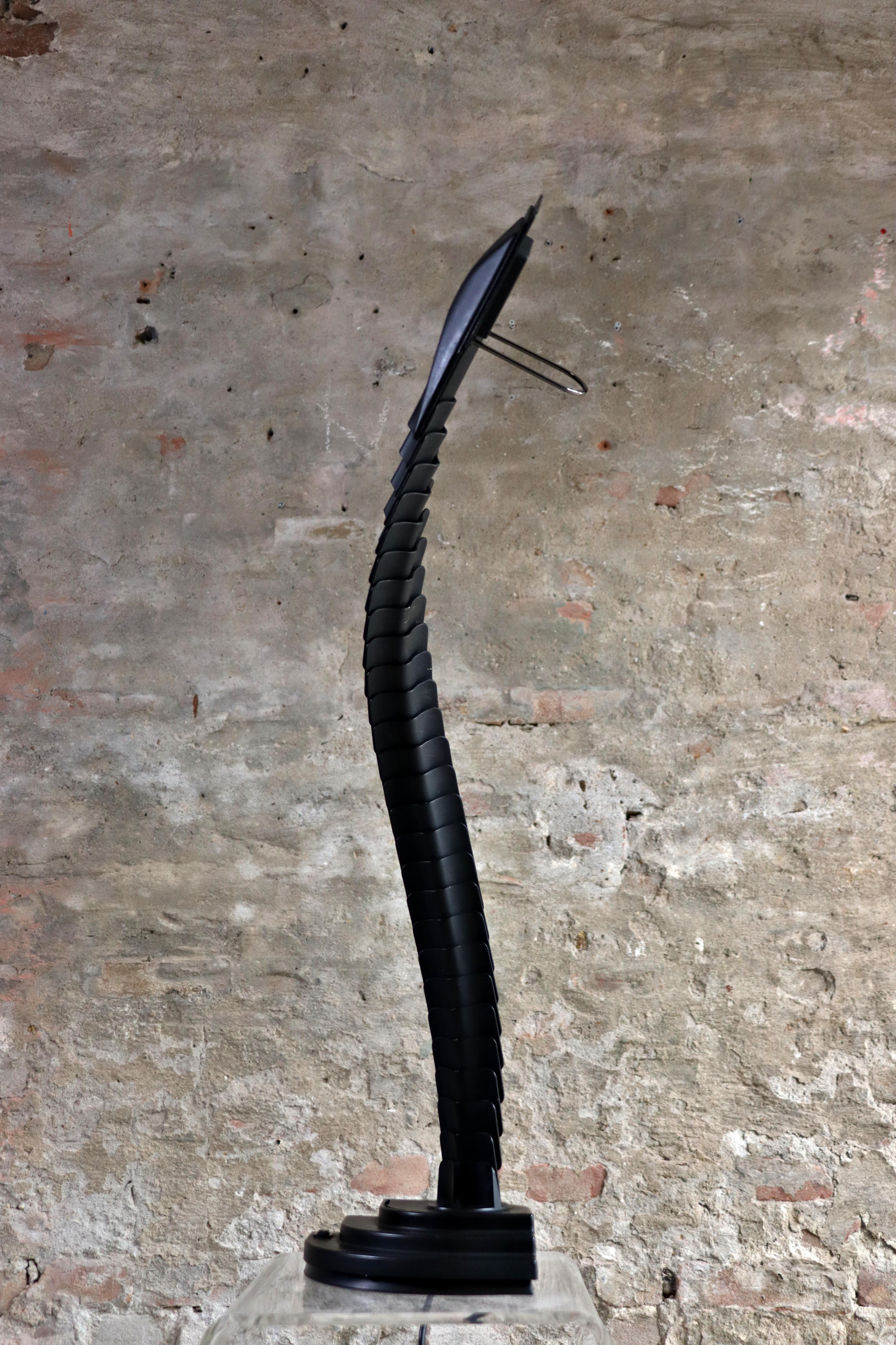 This cool lamp is called Proteo and is designed by Mario Bertorelle for JM RDM Massanzago in Italy in the 1970s. It has scales, so it’s looking like a cobra or dragon. The lamp is inspired by the human spine allow a multitude of creation thanks to