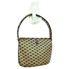 Prototype by Christian Dior, a Handbag in gold-stamped suede - Paris Circa 1950