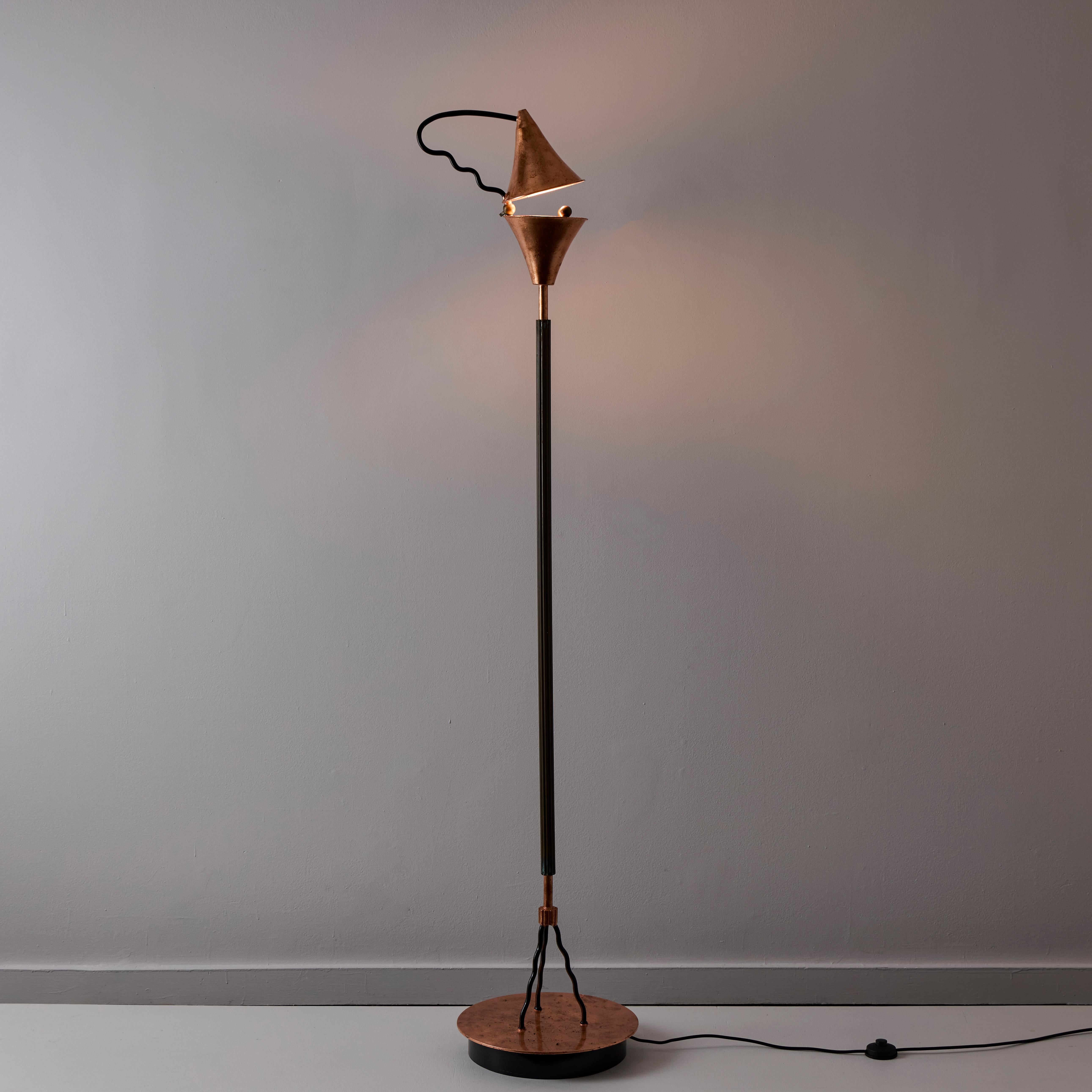 'Prototype' Floor Lamp by Ugo La Pietra for Banci (IT, circa 1980s)

Dual copper cone lamp shade. Top cone can be lifted by handle to orient the light projection. Black powder-coated stem and detailing. Each cone holds a single E27 socket-type,