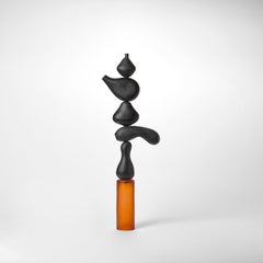 Proud Totem III, a black & orange blown glass sculpture by Simon Moore
