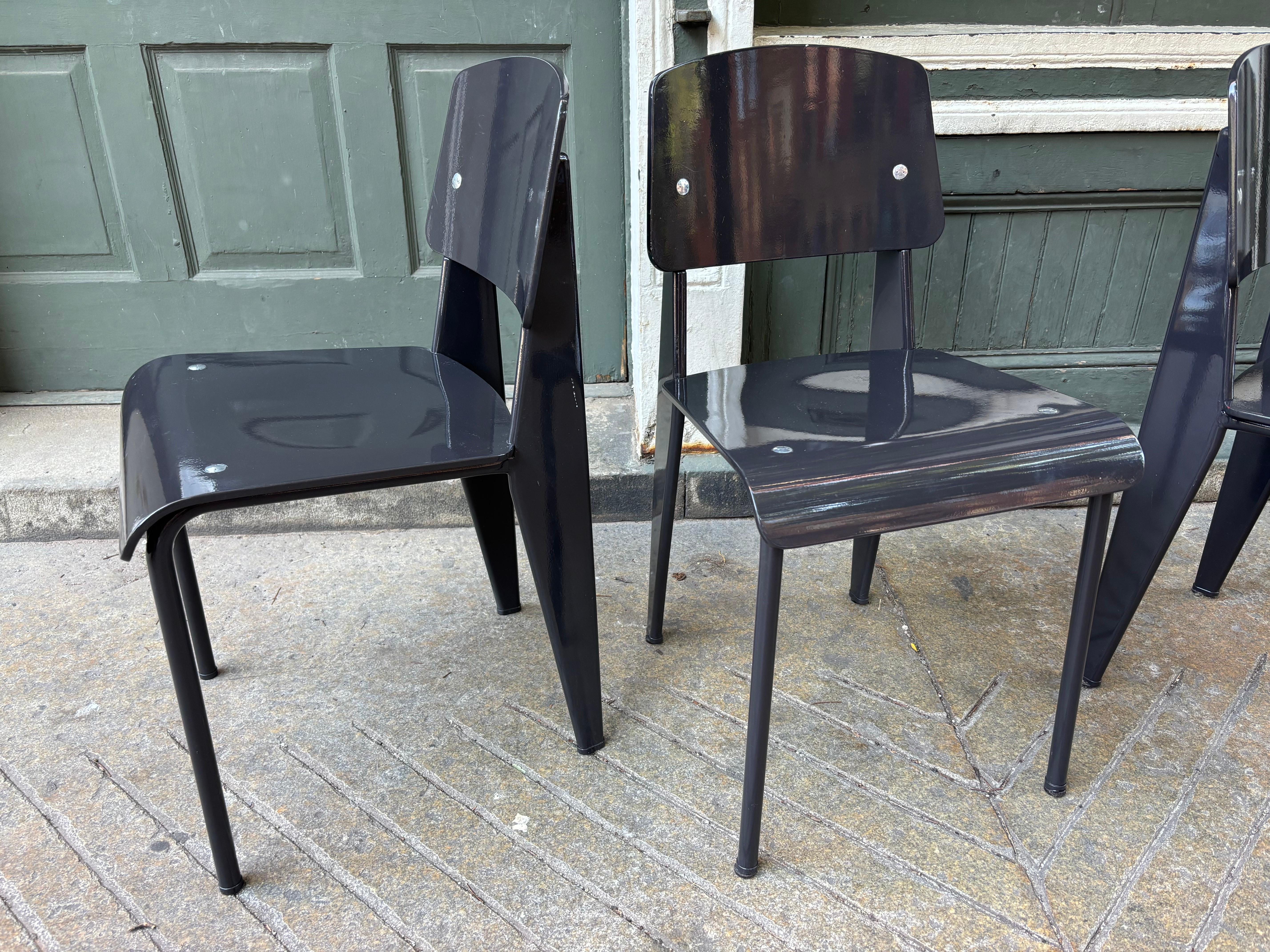 Jean Prouve Standard Chair designed originally in 1934 and later produced by Vitra.  Three Chairs available!  Priced individually!  These chairs date to about 2000, at some point they were painted in a charcoal gray finish!  Round Table available in