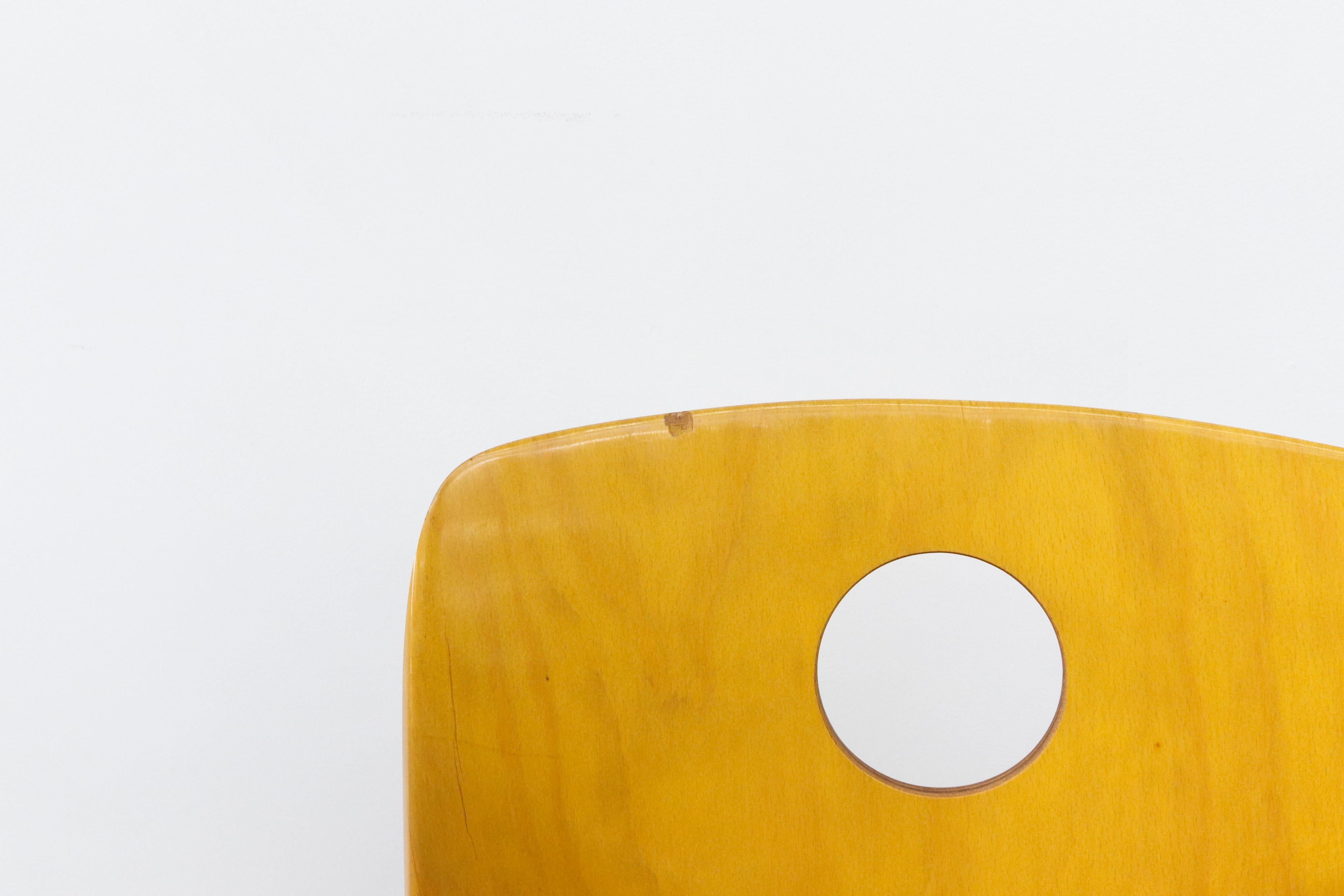 Metal Multi-Colored Stacking Chairs with Circle Cut out