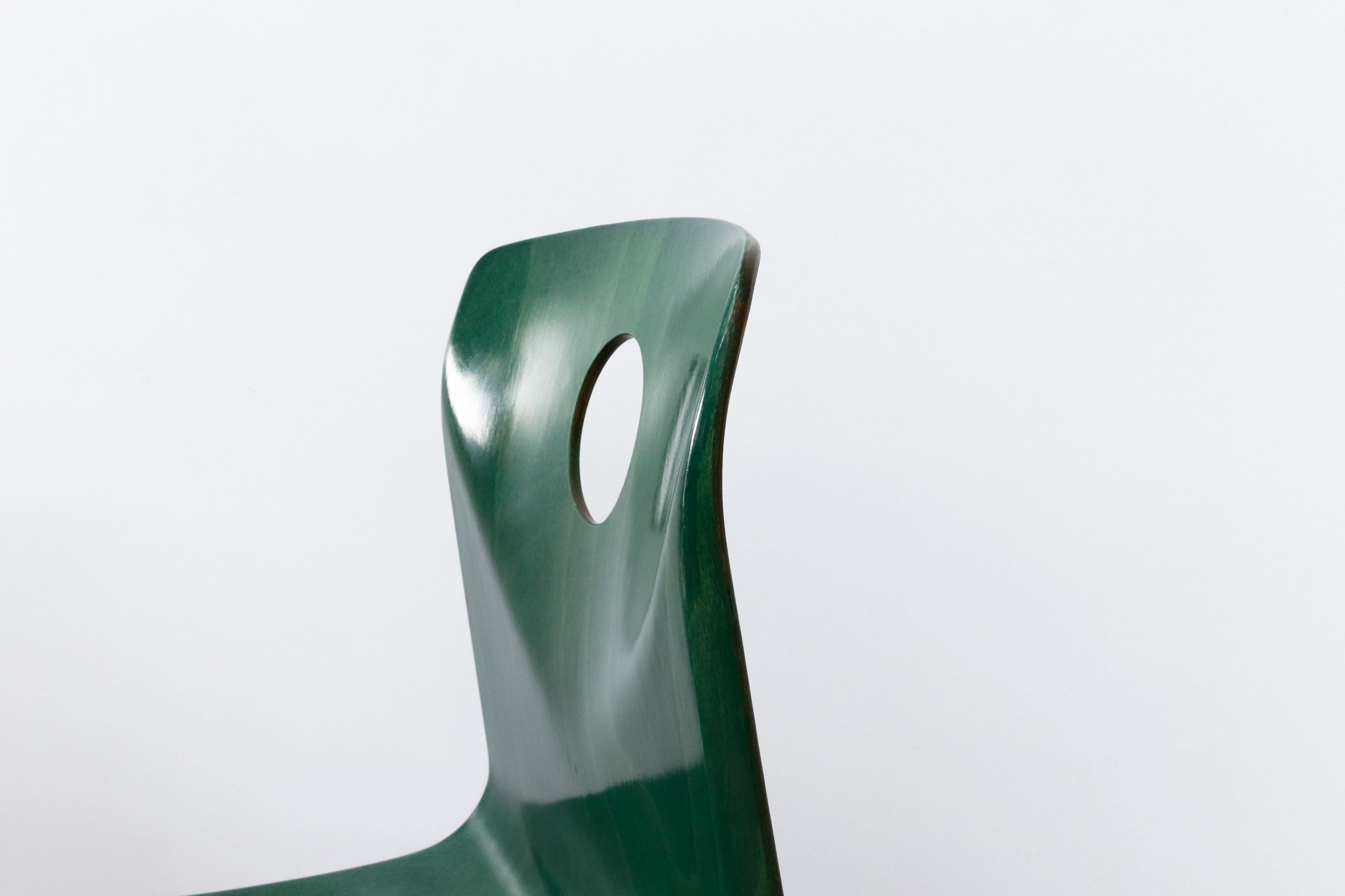 Multi-Colored Stacking Chairs with Circle Cut out 1