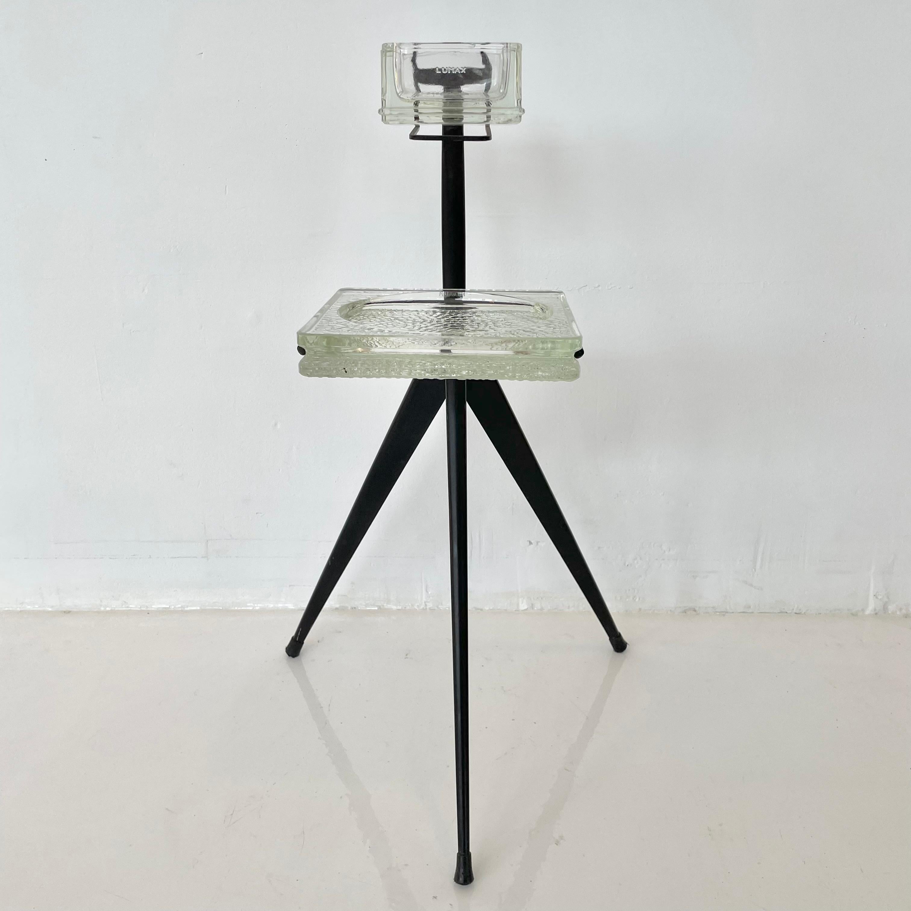 Beautiful two tier ashtray/ catchall in black metal and glass. Prouve style legs and lines. Elegant, simple modern design with an eye-catching appearance. Both glass trays are removable for cleaning.