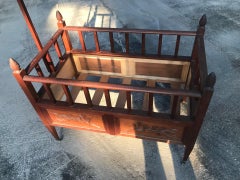 Provençal child's bed in carved wood
