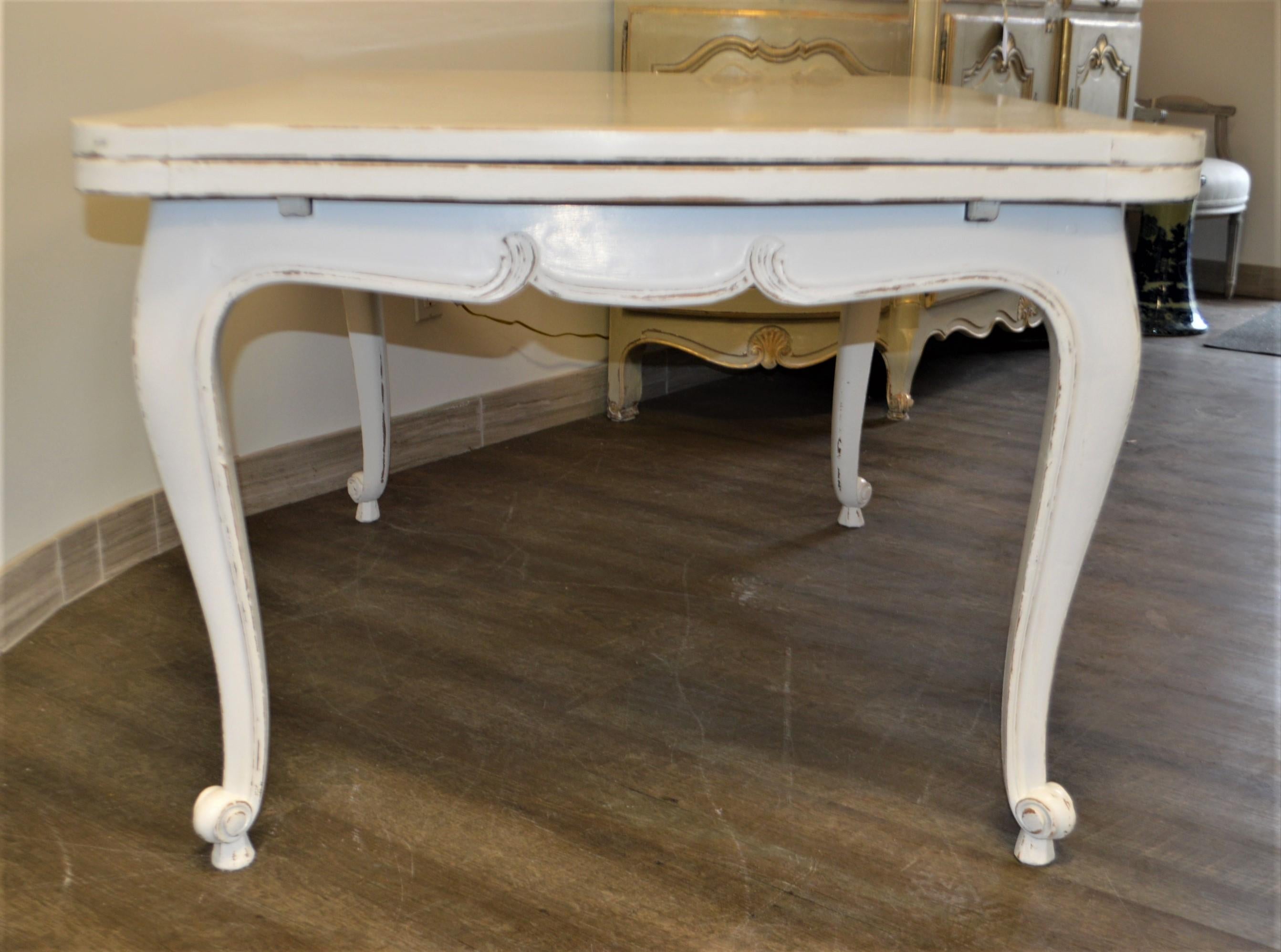 Antique white painted dining table with two pullout / pull-out leaves, the size is suitable for a desk as well. As the extended leaves could be used for printer and other desk needs.
Each side pullout / pull-out leaves are 19 1/2