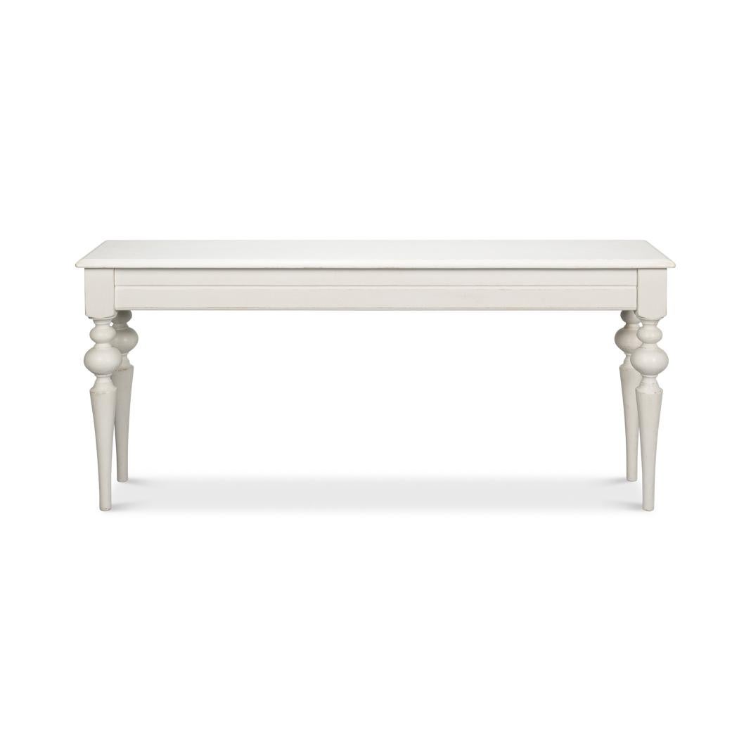 Beautifully crafted piece of furniture that exudes sophistication and rustic elegance. Finished in a rustic antiqued white paint. Its molded edge top is a standout feature, adding a touch of sophistication to your living space.

The unique turned