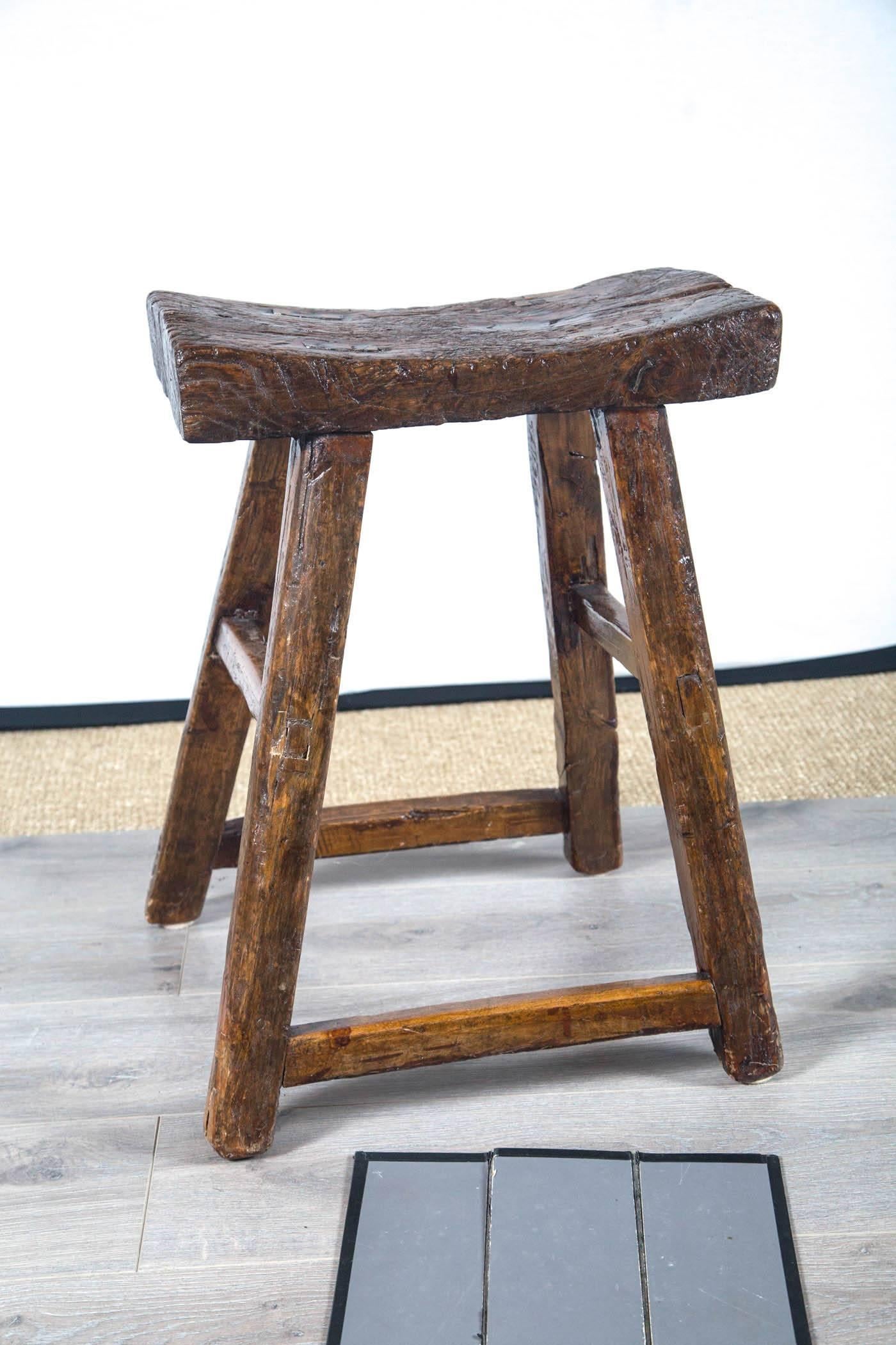 Provincial Asian stool, circa 1900. Rustic mortise and tenon construction. Wonderful dark aged patina.