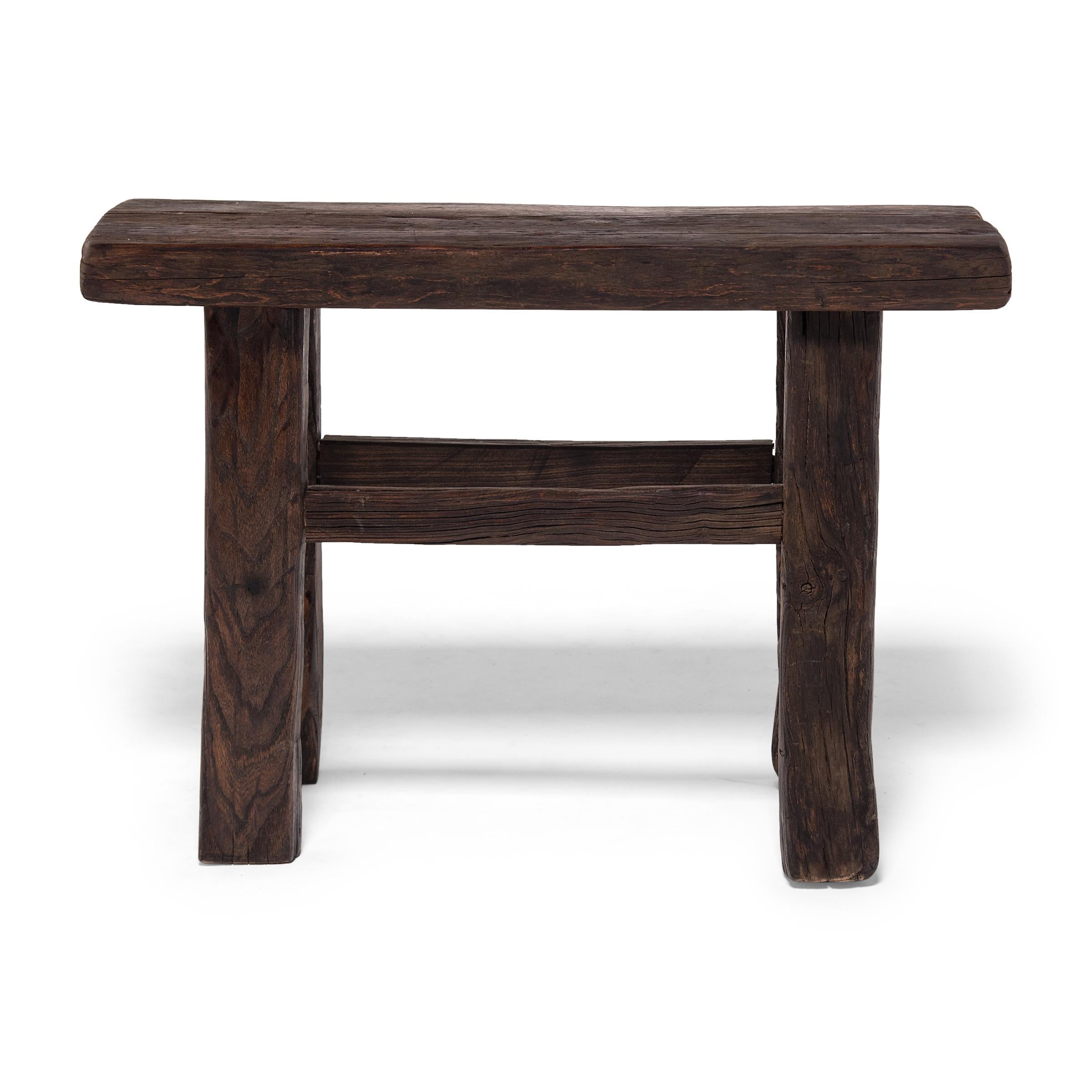 Made of wood reclaimed from 18th century Chinese buildings, this petite door bench brings the farmhouse modern aesthetic to traditional forms. Skilled in traditional joinery techniques, our craftspeople fashioned this simple bench to resemble those