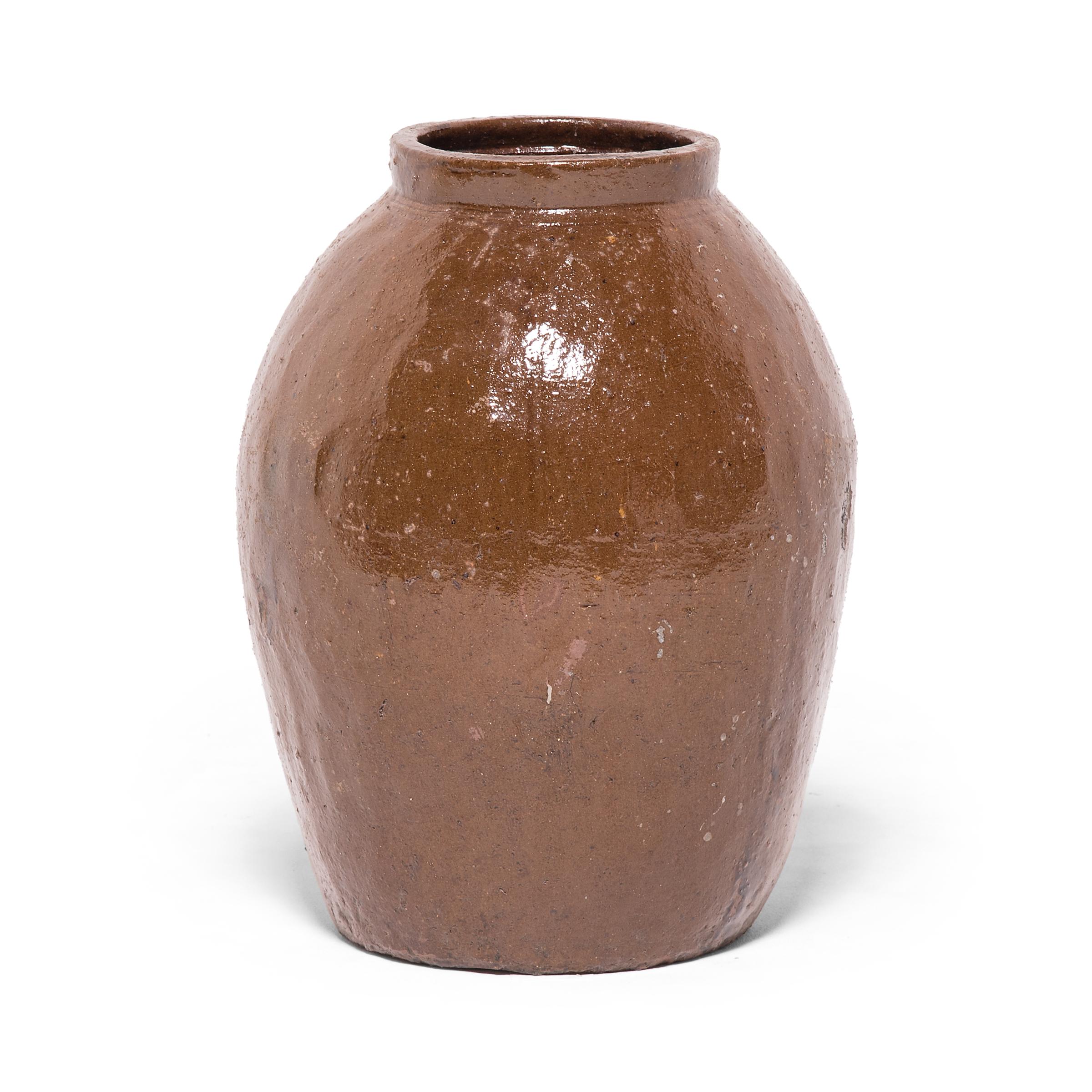 At once ancient and contemporary, this beautiful tapered urn speaks to the timelessness of Chinese ceramic design. Made in Tianjin in the early 20th century for use as an everyday storage vessel, the jar pays respect to materials and Craft,