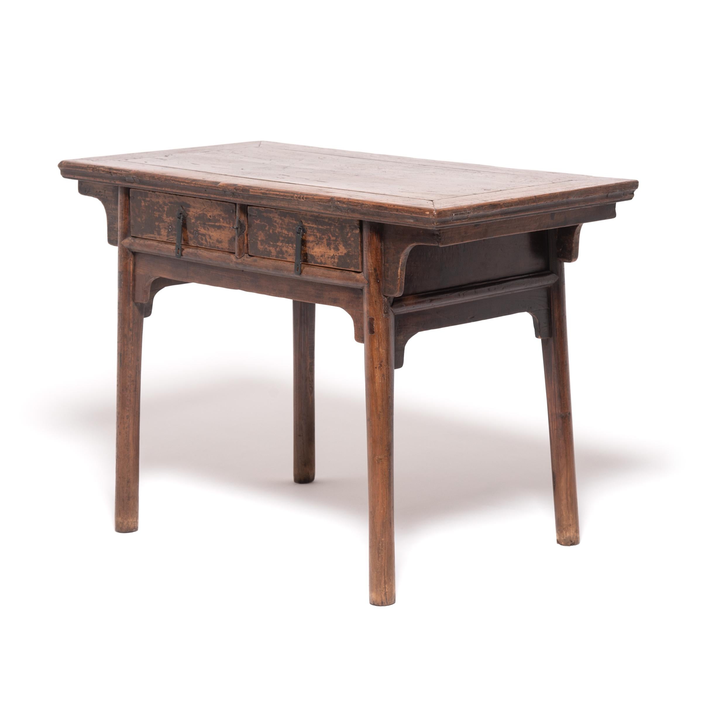 Crafted of northern elmwood in China's Shanxi province, this early 19th-century altar table was once used to display an ancestral shrine in a provincial Confucian household. Incense, candles, and fruits would have covered the narrow table as