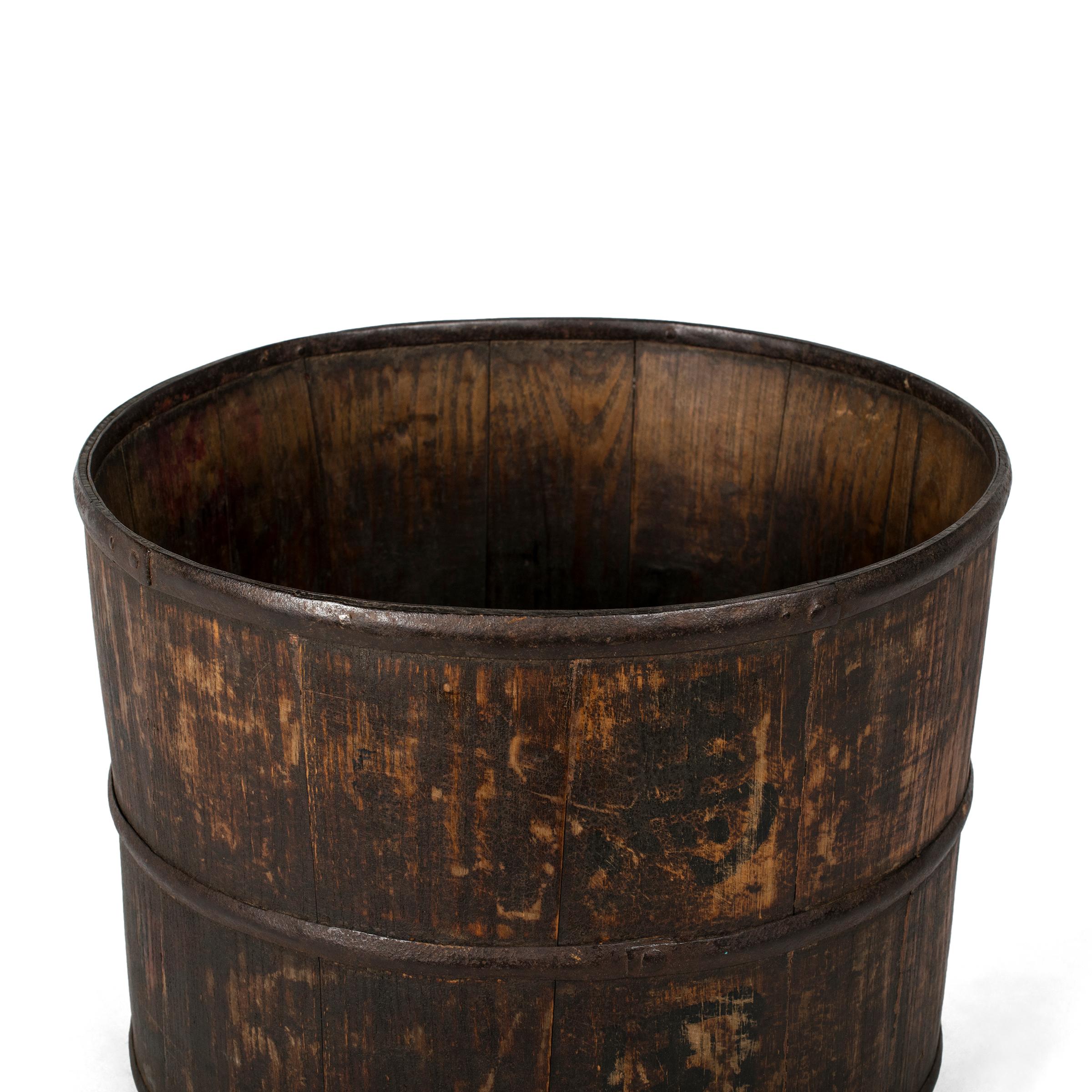 This vintage water bucket has a beautiful patina that can only be achieved with time - a look that contemporary designers often attempt to recreate. The beauty of this water bucket comes from its utilitarian simplicity. Even after years of use the