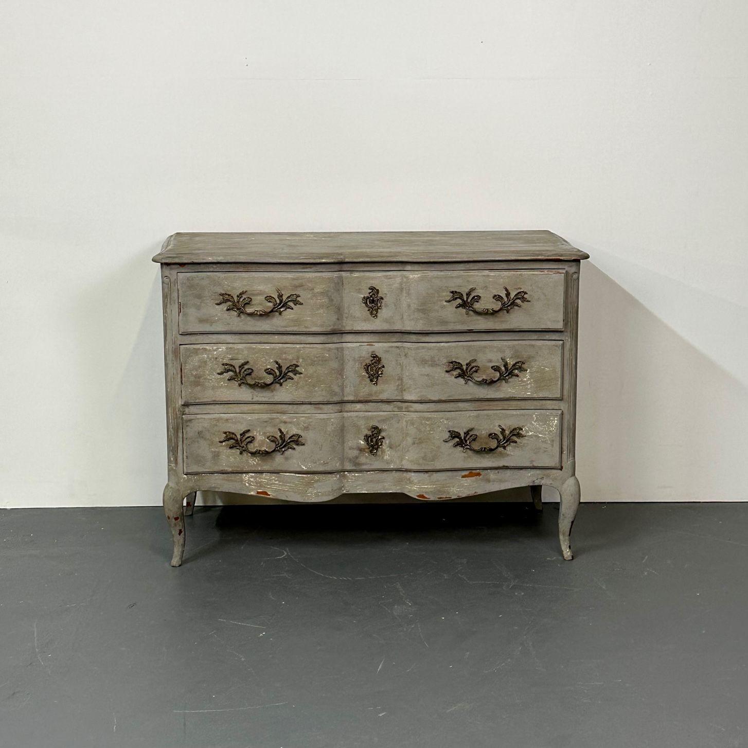 Provincial Gustavian Style Swedish paint decorated / Distressed Commode, Chest
Beautifully aged paint distressed Swedish dresser. The case having three drawers and antiqued brass hardware The serial number located on the reverse. 
LlS
Wood,