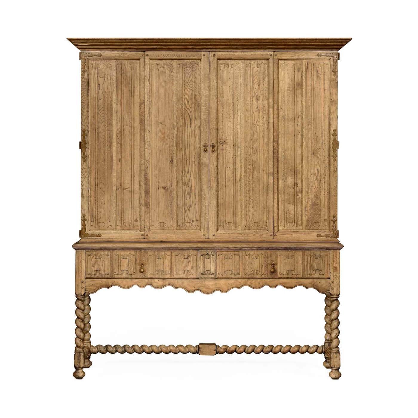 An early European Provincial style carved linen-fold natural oak TV cabinet with hinged fold-away doors and a built-in infrared repeater system hidden behind the drawers. With an open base beneath two drawers with additional linen-fold carvings