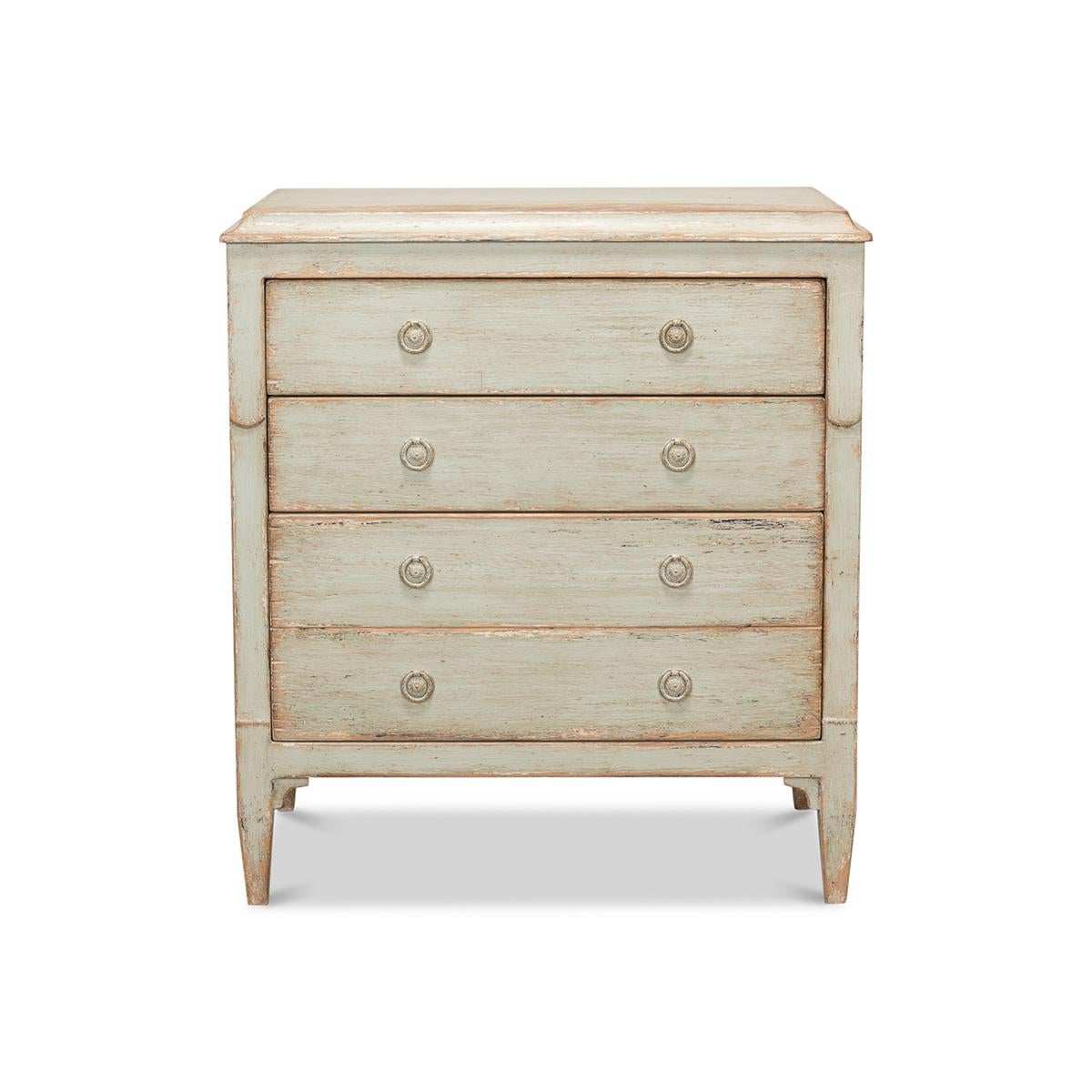 18th-century neo classically inspired sage-painted chest of drawers. With a molded edge rectangular top, paneled side, antiqued hardware and square tapered legs. This perfectly scaled three-drawer commode, constructed of reclaimed pine with a