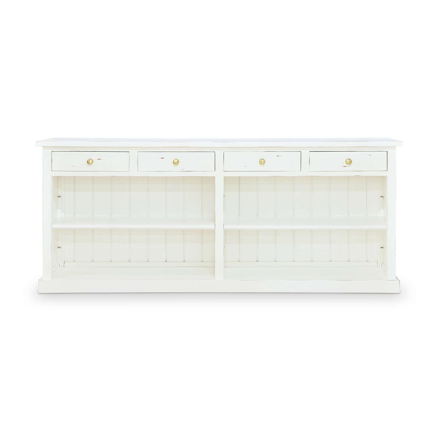 This beautifully crafted piece combines practical storage with a light, airy design, perfect for enhancing any living or dining space.

Built with solid mahogany and hand-finished in our distressed White Harvest finish, this buffet features a