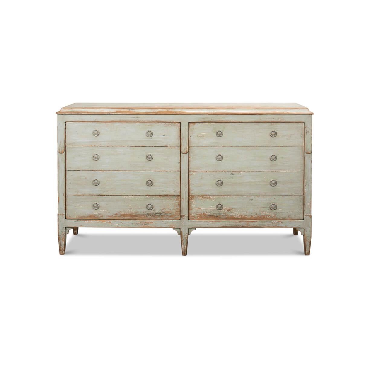 This beautifully aged piece embodies the charm of Europe in a bygone era, featuring a distressed sage painted finish that tells a story in every scratch and patina.
Offering ample storage behind two faux drawer front cupboard doors, it's as