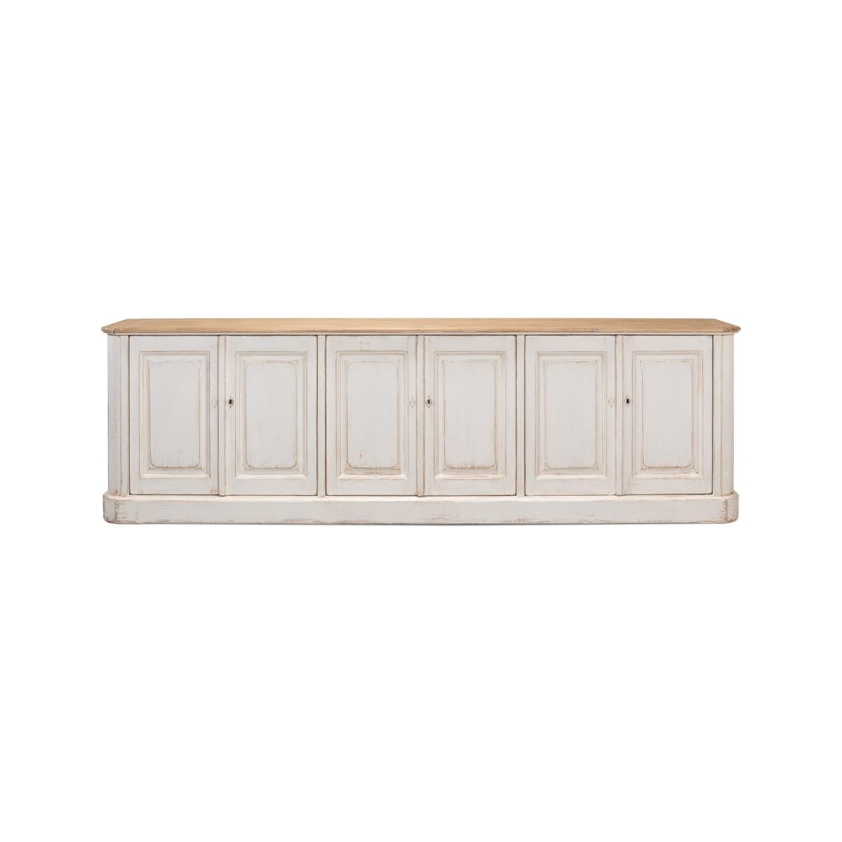 Made with reclaimed pine. The six-door long sideboard buffet is painted in an antiqued rustic whitewash paint and has a natural pine top with a molded edge. The painted interior has removable shelves.

Dimensions: 119