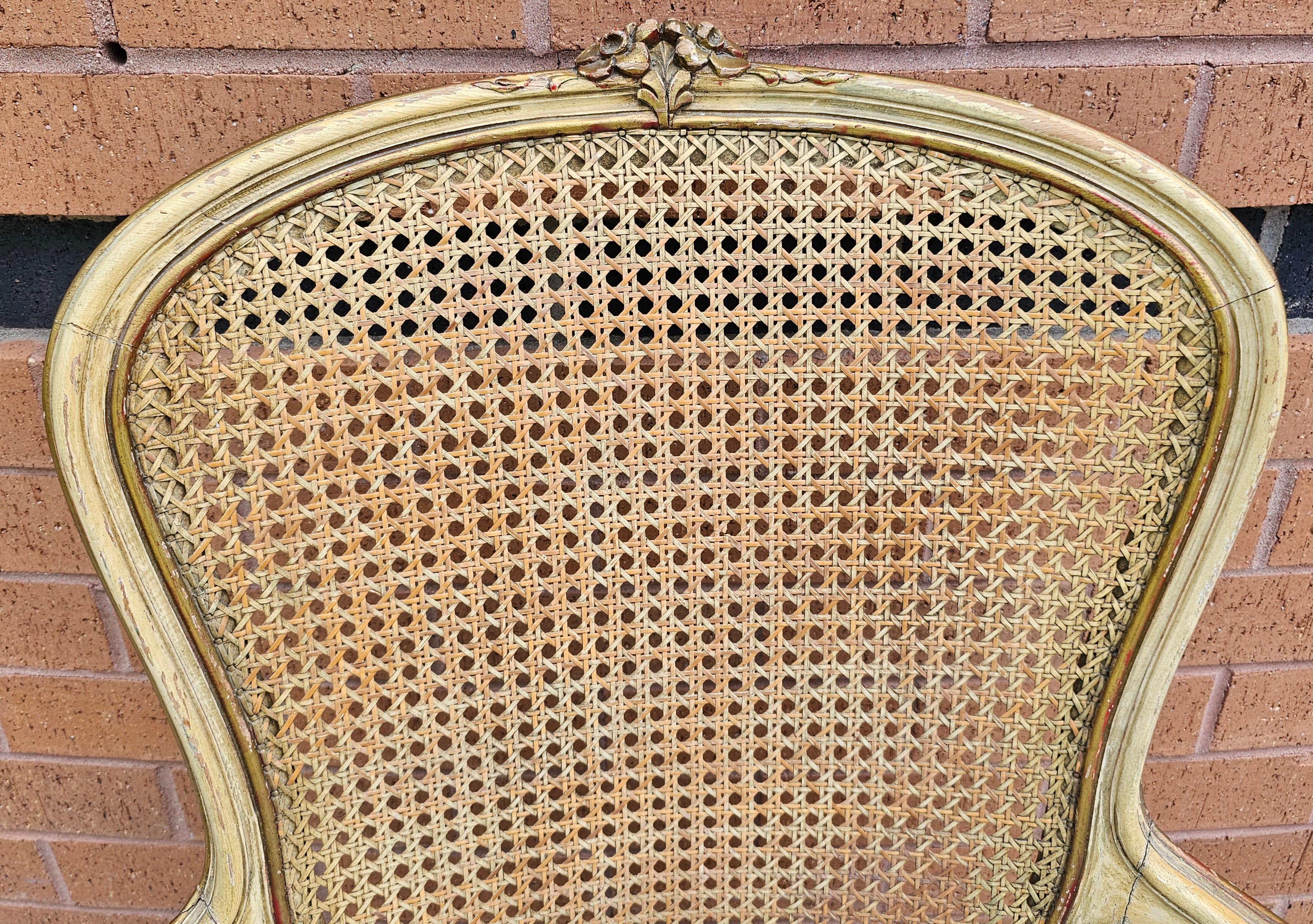 Carved Provincial Yellowish Enamel, Caned Back And Upholstered Seat Bergere Chair For Sale