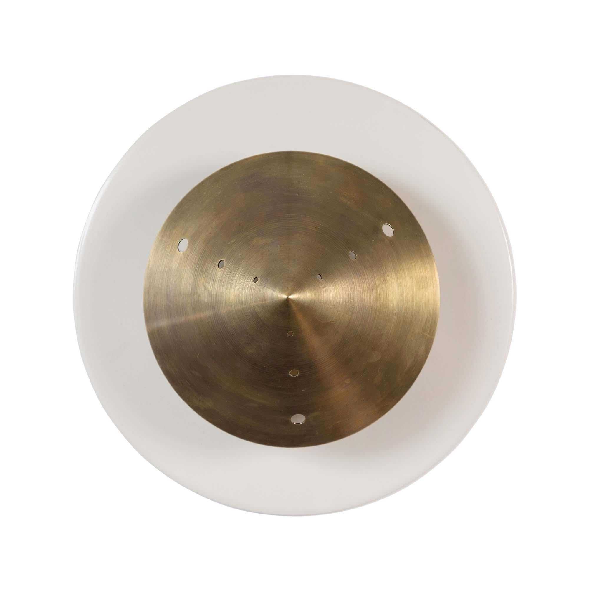 The Pruckel sconce features a circular backplate with a conical perforated brass Shade.

The Lawson-Fenning Collection is designed and handmade in Los Angeles, California.