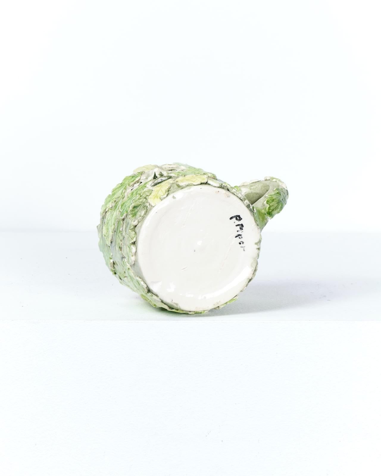 Faïence décorée et appliquée
H9 x W10 x D9 cm