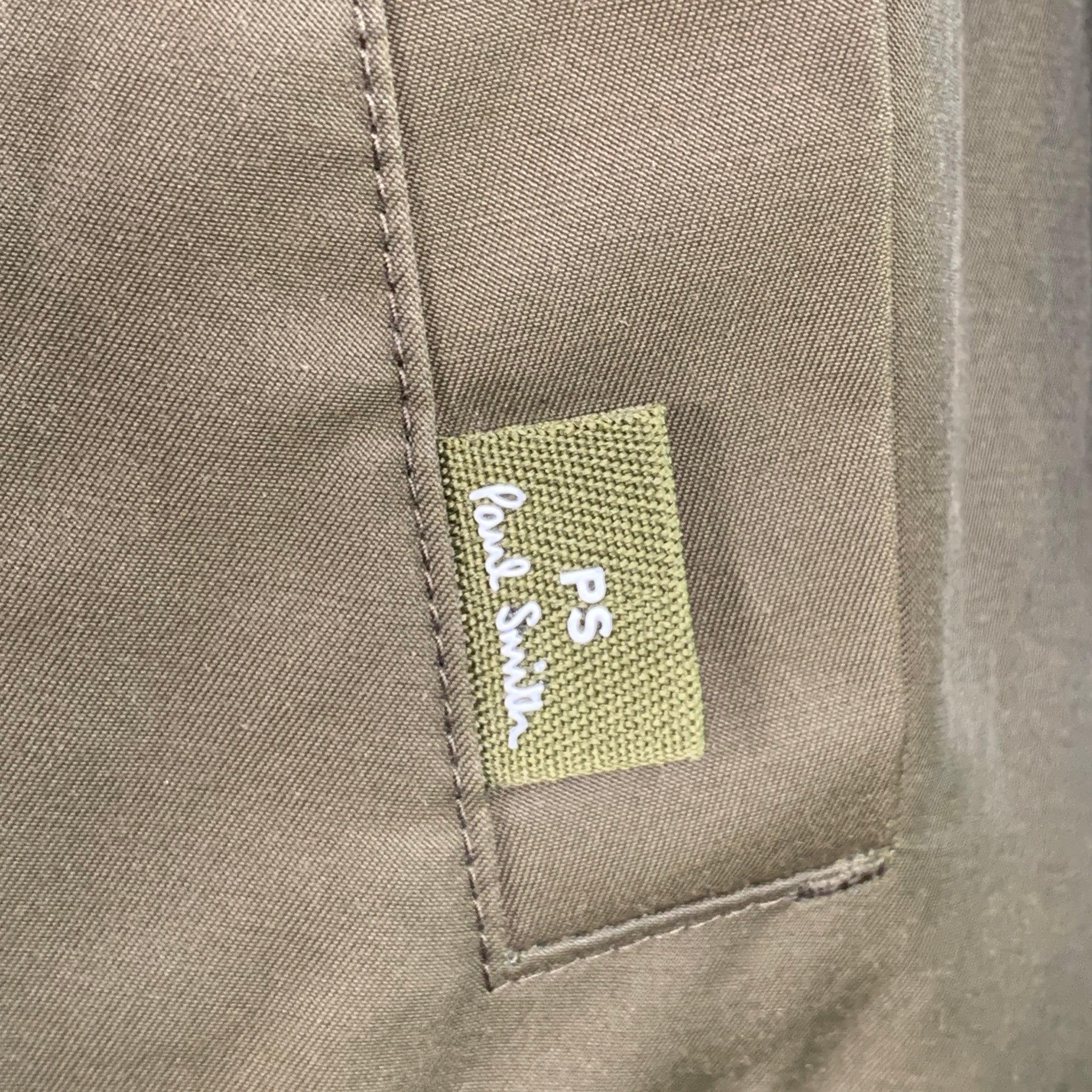 PS by PAUL SMITH jacket
in an olive green cotton nylon blend fabric featuring a hooded windbreaker style, multiple snap pockets, and zip & snaps closure with drawstring waist.Excellent Pre-Owned Condition. 

Marked:   M 

Measurements: 
 
Shoulder: