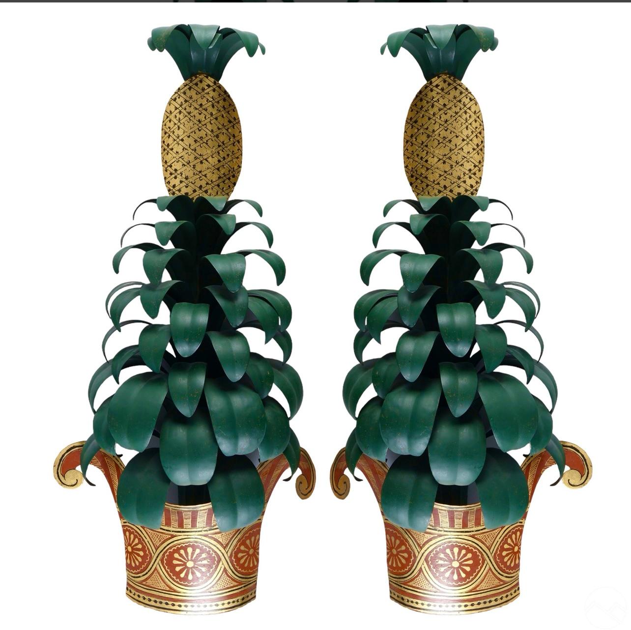 Just in,  this superb pair of sculptural and whimsical French 1950s Maison Jansen Pineapple Tole Topiary Wall Sconces.
These are quite rare.
The Green leaves are tiered to the top  and ends with a Pineapple finial.
The full topiaries stands on very