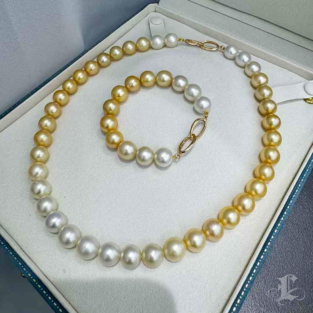 This exquisite pearl jewelry set features a breathtaking gradient design that seamlessly transitions from radiant South Sea golden pearls to luminous white pearls. The 47cm necklace and 19cm bracelet showcase the natural beauty and elegance of these