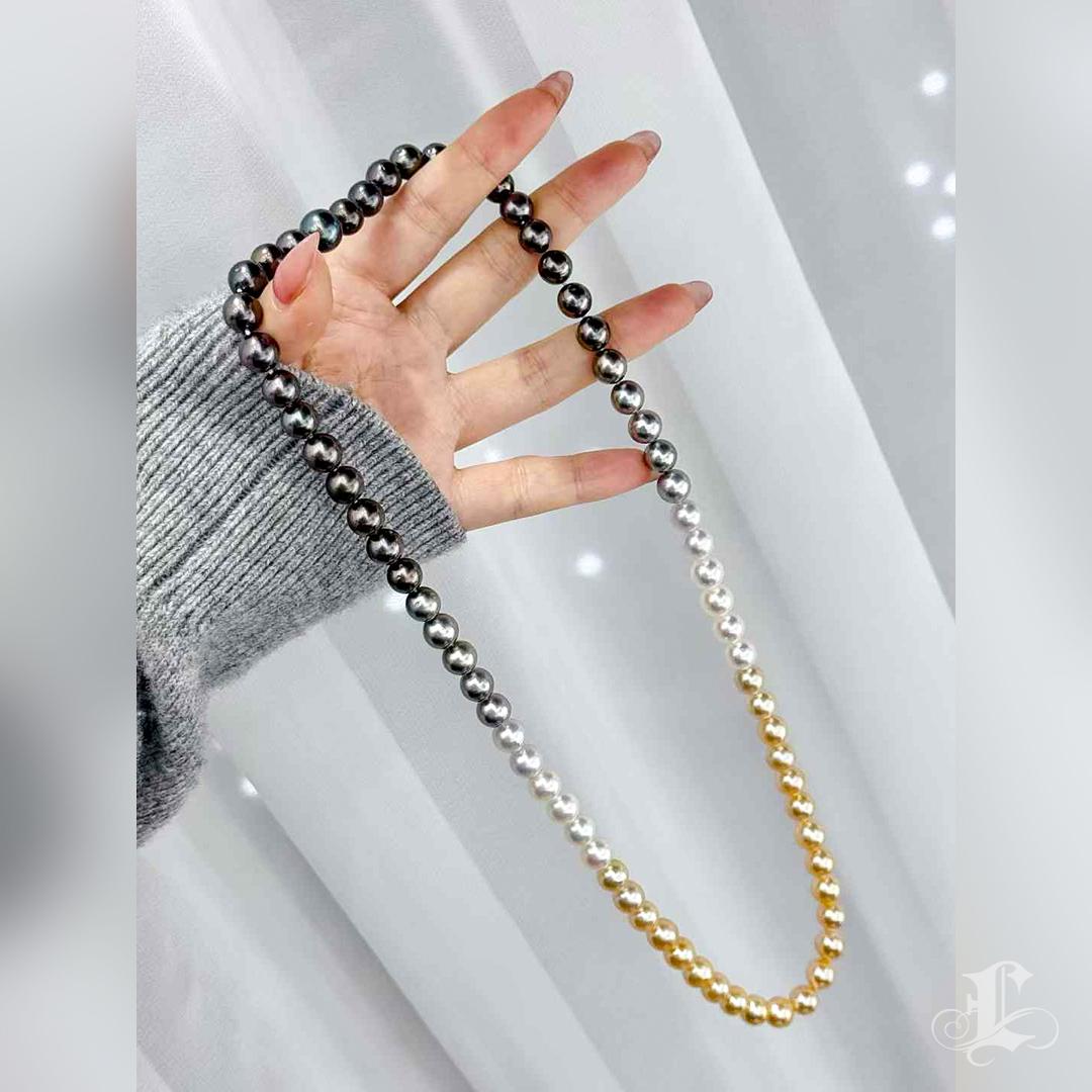 This exquisite 65cm pearl necklace is a harmonious blend of Japan Akoya, South Sea golden, and Tahitian pearls, creating a stunning gradient of natural colors. While some pearls may have slight imperfections and irregular shapes, their breathtaking