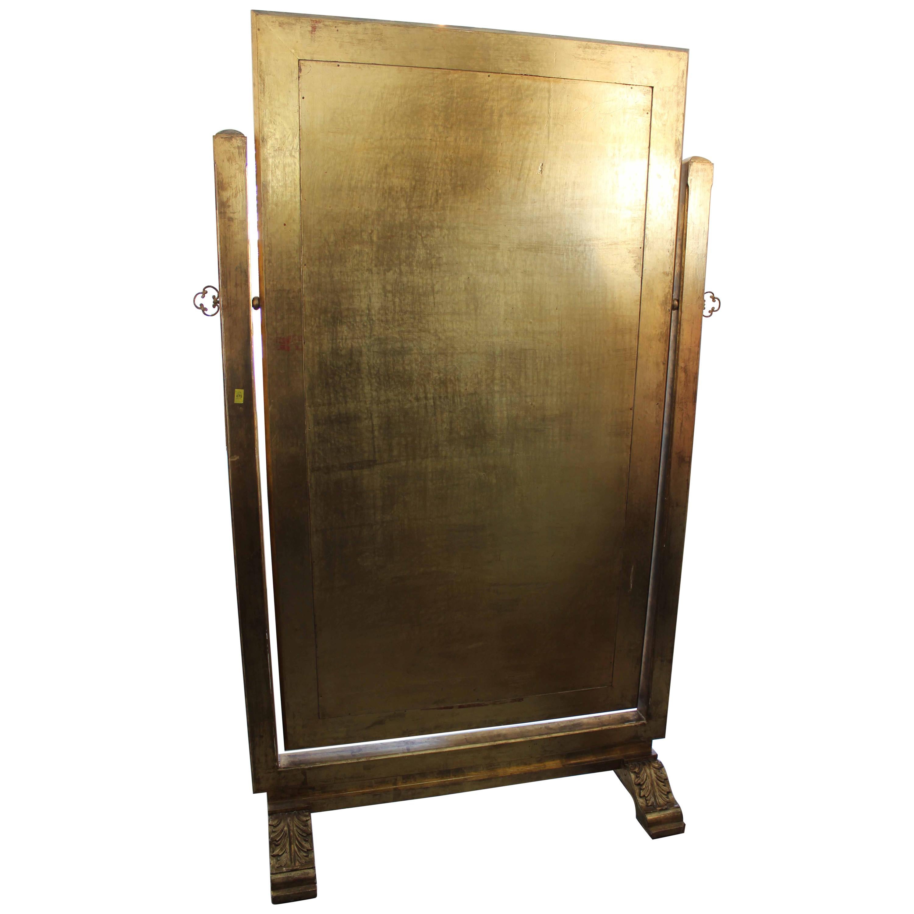 Free standing Psyche mirror. Also called Cheval Mirror. Offering an adjustable angle, that can be tilted then immobilized by 2 chiseled brass ring screws at each sides. Double trestle foot, 20