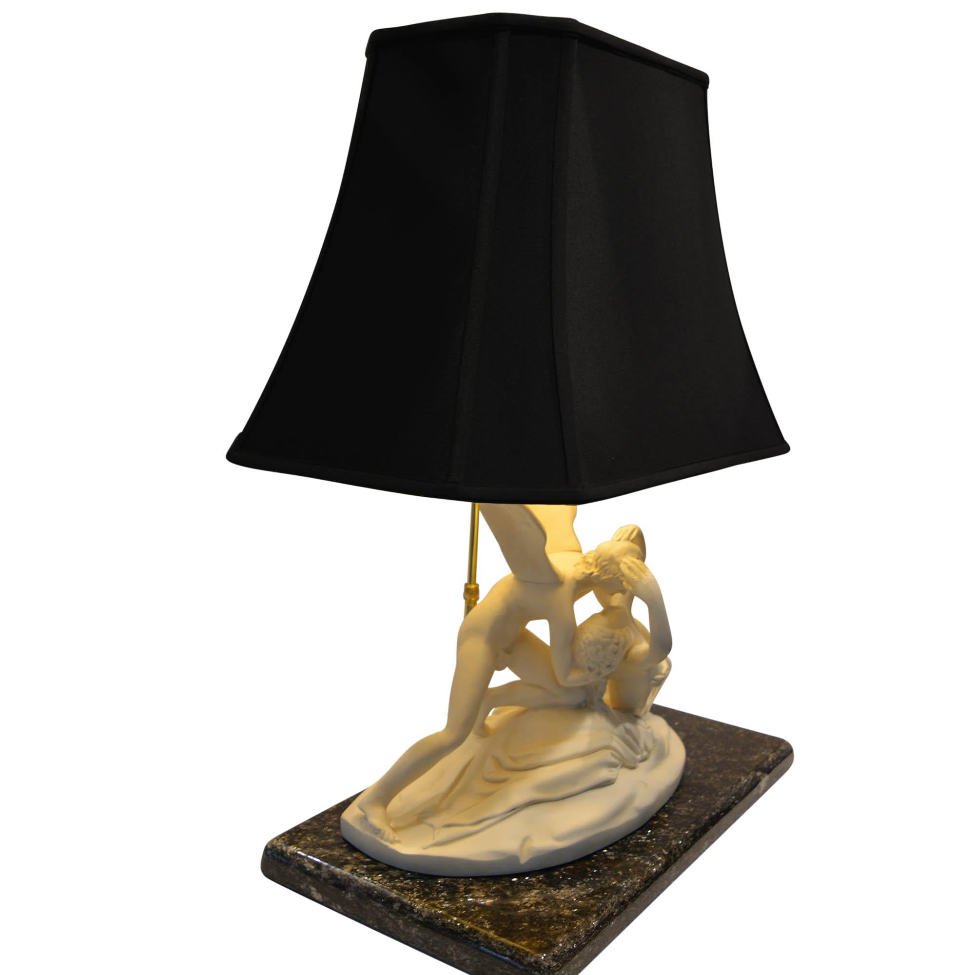 This lamp depicts a version of the much copied Psyche Revived by Cupid's Kiss statue. We have selected a nice dark marble base with plenty of flecks of shimmer and attached felt underneath. Marble is approximately 1.5