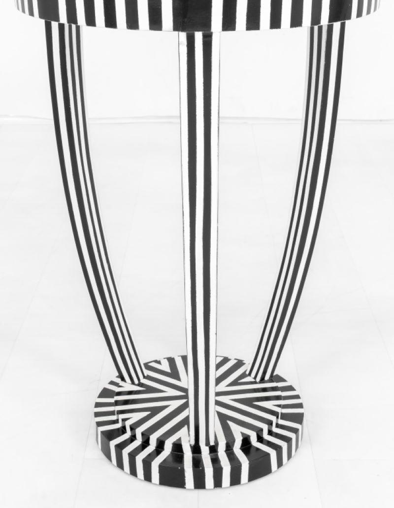 Psychedelic painted circular center table or gueridon dable in the Art Deco taste, painted in black and white dazzle camouflage. 30