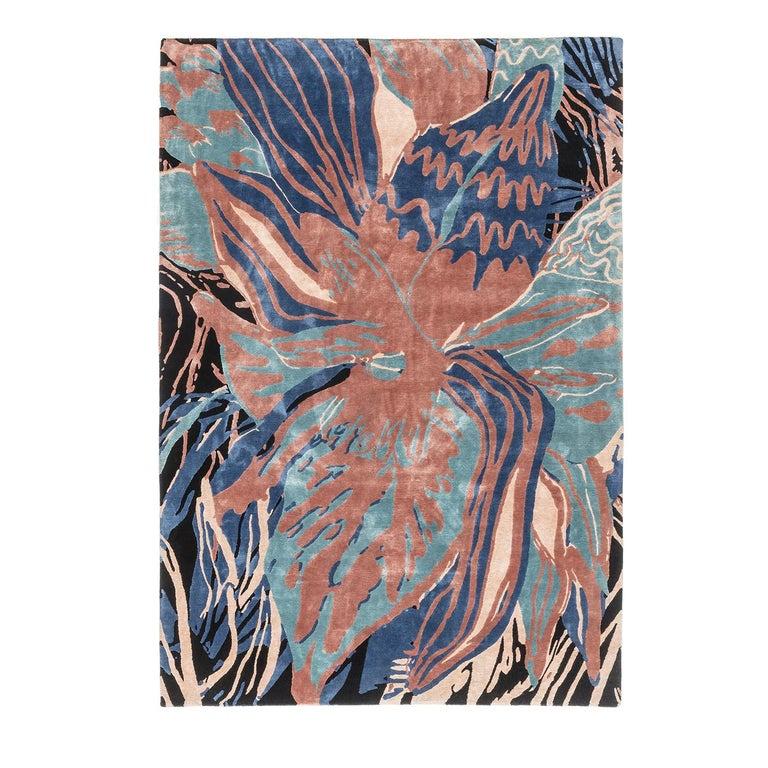 This striking rug was entirely hand knotted using silk, wool, tencel, and linen over a cotton base. Its unique decoration reinterprets the classic floral theme in an oversized scale that makes it almost abstract. Using colors inspired by the