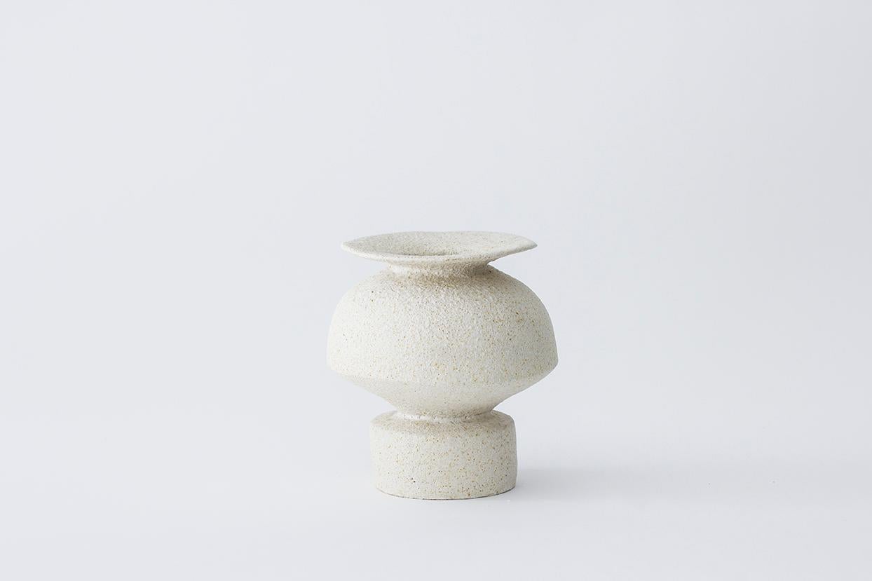 Psycter Hueso stoneware vase by Raquel Vidal and Pedro Paz
Dimensions: 15 x 16 cm
Materials: Hand-sculpted, glazed pottery

The pieces are hand built white stoneware with grog, and brushed with experimental glazes mix and textured surface,