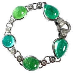 PT/950 Platinum Bracelet with 4 Paraiba 53.02c and 1 Tourmaline Cab. 13.08c.