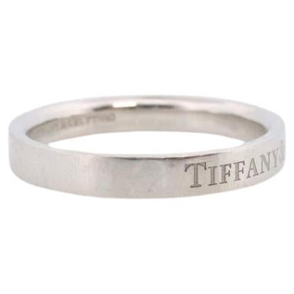 Vintage from the 1990s
Size: 6 3/4 US
Materials: tiffany diamond ring, 18k tiffany ring, Tiffany band
Gem color: Colorless

Band color: Gold

Tiffany and Co. Hallmarked Tiffany & Co. and Plat950. Tests appropriately.

Platinum Tiffany &