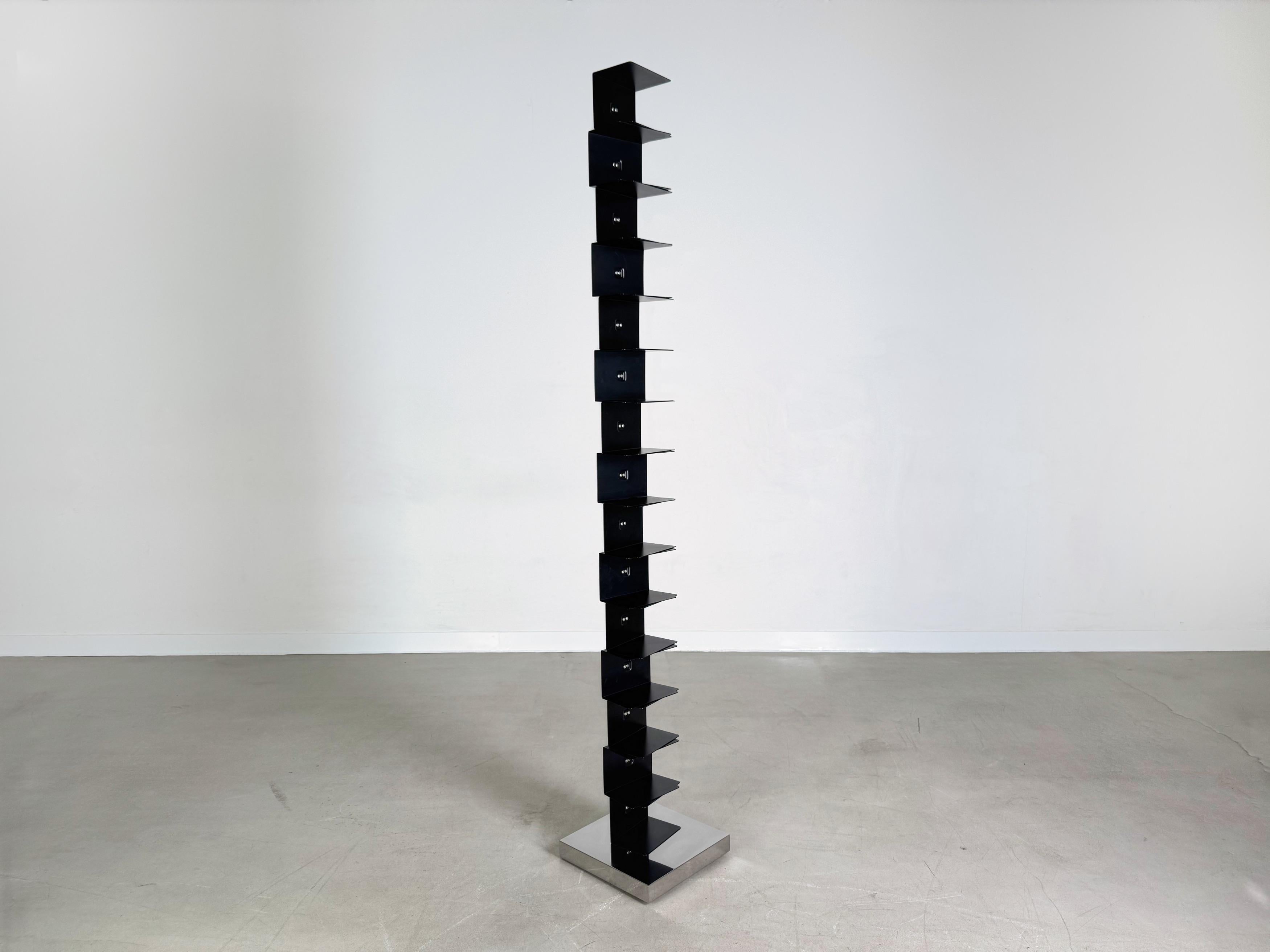 We offer a beautiful Ptolomeo book tower book tower by Opinion Ciatti for sale. The design was created by Bruno Rainaldi and won the Italian design prize “Compasso D'oro Adi” in 2004. The bookcase is produced in three different lengths, whereby this