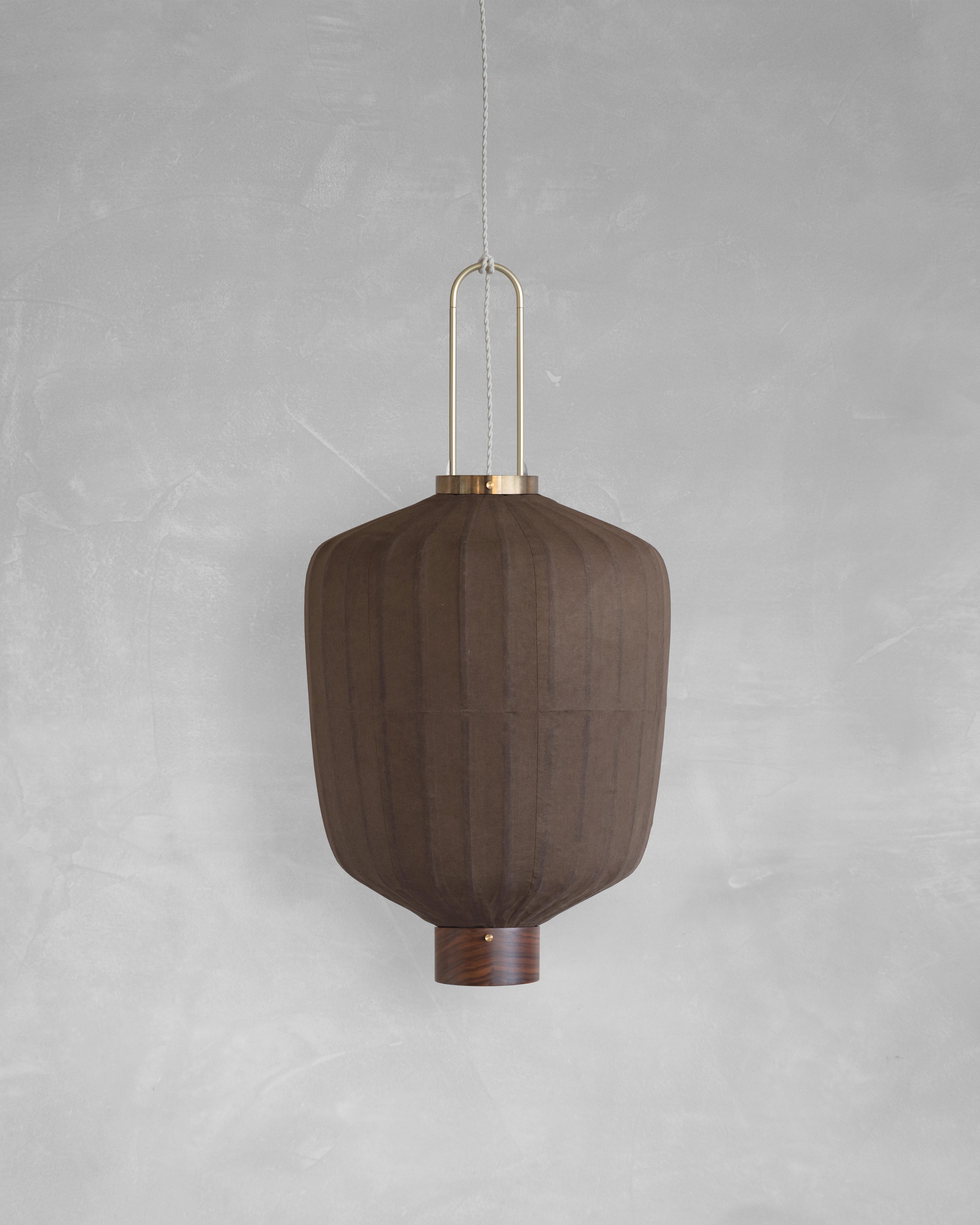 PU02B Pendant Lamp L by Taiwan Lantern
Dimensions: D 42 x W 42 x H 52 cm.
Material: Walnut & bamboo frame, Hand-colored fabrics, Metal pipes, Leather lace, Handmade porcelain ceiling cap.


This brown color is inspired by Wu Xing 五行. Brown presents