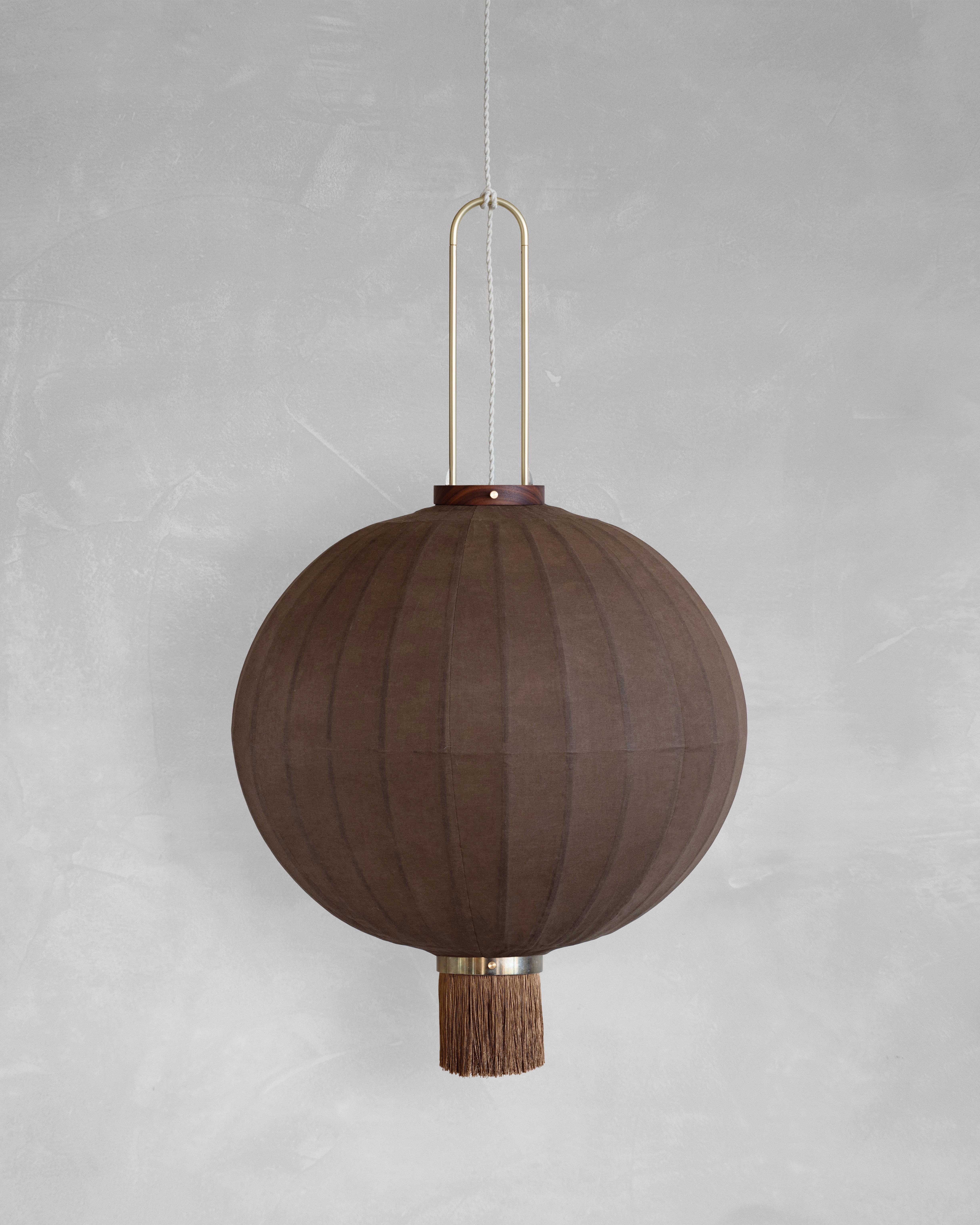PU02M Pendant Lamp L by Taiwan Lantern
Dimensions: D 57 x W 57 x H 50 cm.
Material: Walnut & bamboo frame, Hand-colored fabrics, Metal pipes, Leather lace, Handmade porcelain ceiling cap.


This brown color is inspired by Wu Xing 五行. Brown presents
