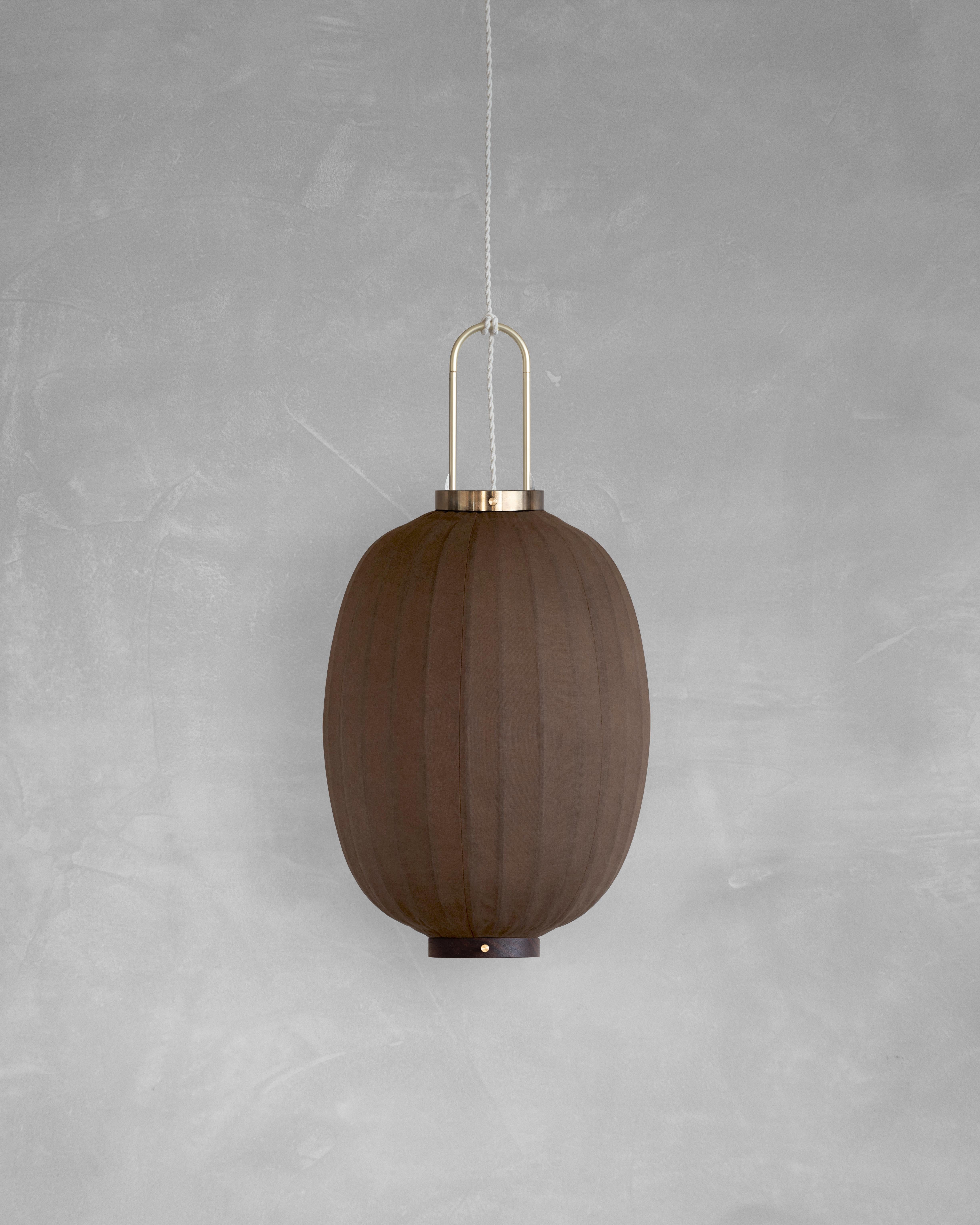 PU02O Pendant Lamp L by Taiwan Lantern
Dimensions: D 35 x W 35 x H 49 cm.
Material: Walnut & bamboo frame, Hand-colored fabrics, Metal pipes, Leather lace, Handmade porcelain ceiling cap.


This brown color is inspired by Wu Xing 五行. Brown presents