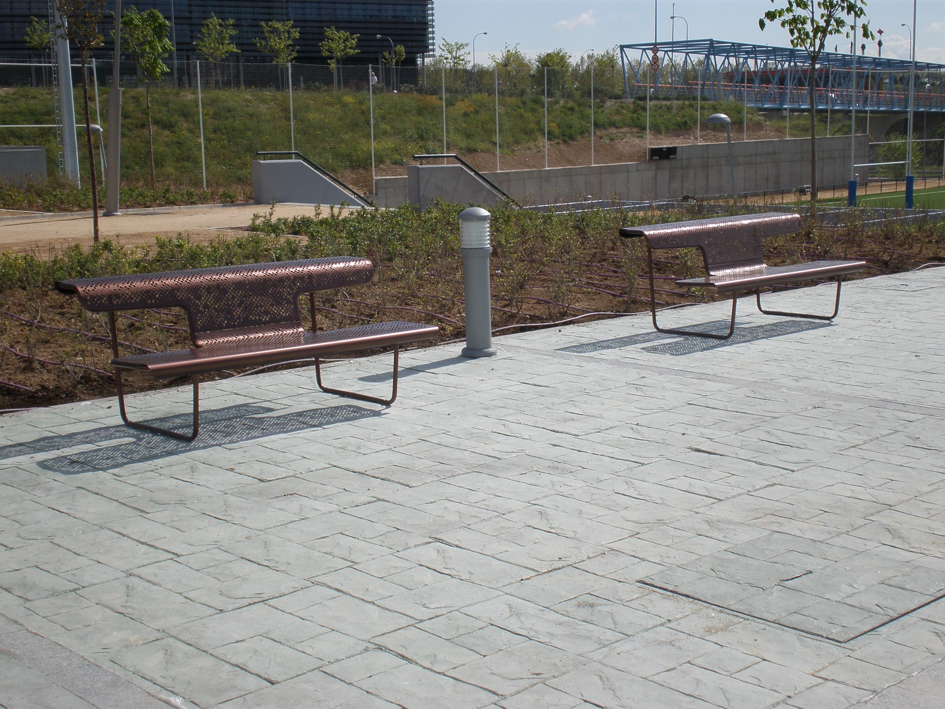 Public bench in perforated steel designed by Alfredo Häberli model 